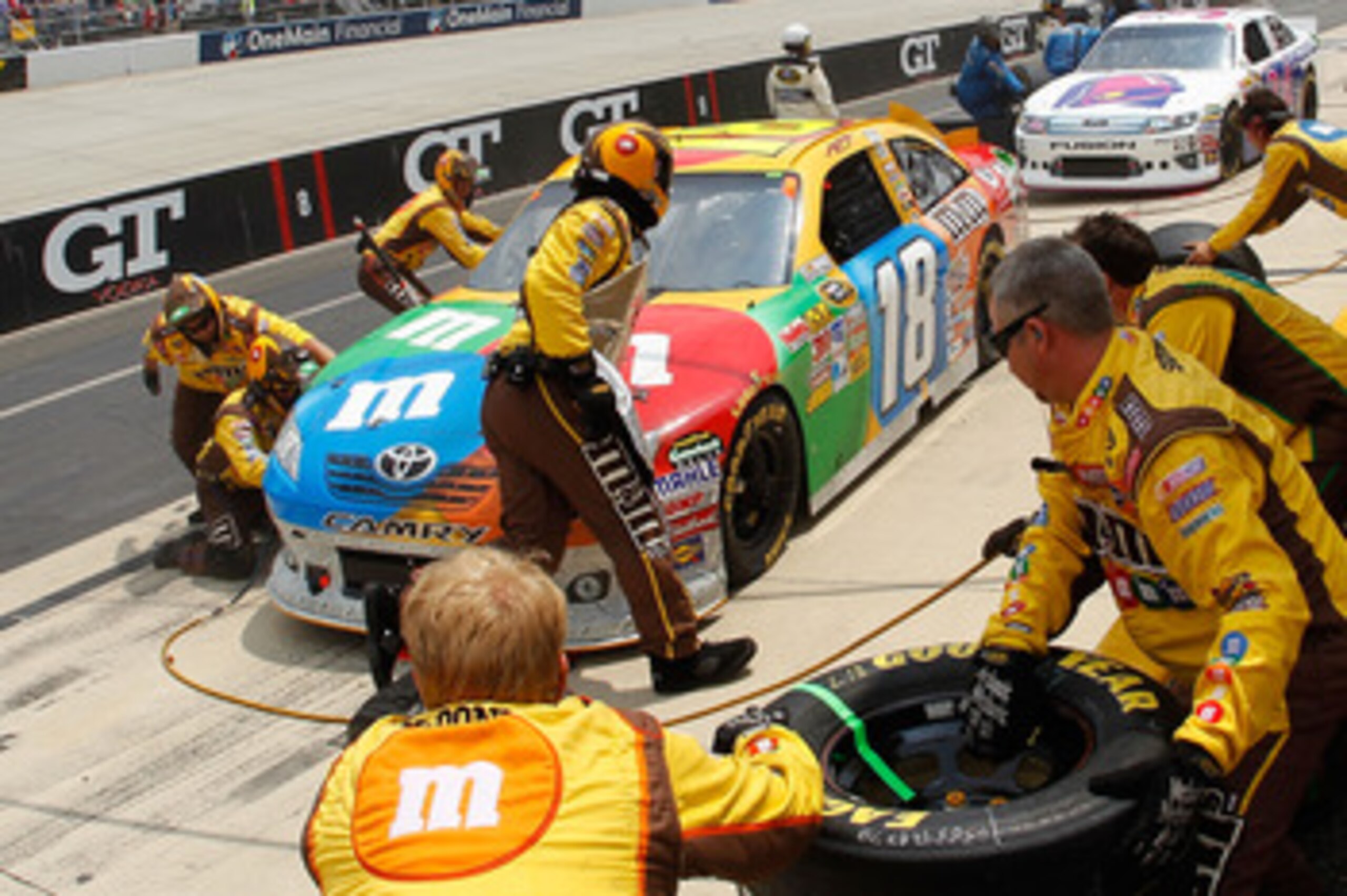 DOVER, DE - MAY 15: Kyle Busch, driver of the #18 M&M's Toyota, pits during the NASCAR Sprint Cup Series FedEx 400 Benefiting Autism Speaks at Dover International Speedway on May 15, 2011 in Dover, Delaware. (Photo by Todd Warshaw/Getty Images for NASCA DOVER, DE - MAY 15: Kyle Busch, driver of the #18 M&M's Toyota, pits during the NASCAR Sprint Cup Series FedEx 400 Benefiting Autism Speaks at Dover International Speedway on May 15, 2011 in Dover, Delaware. (Photo by Todd Warshaw/Getty Images for NASCA