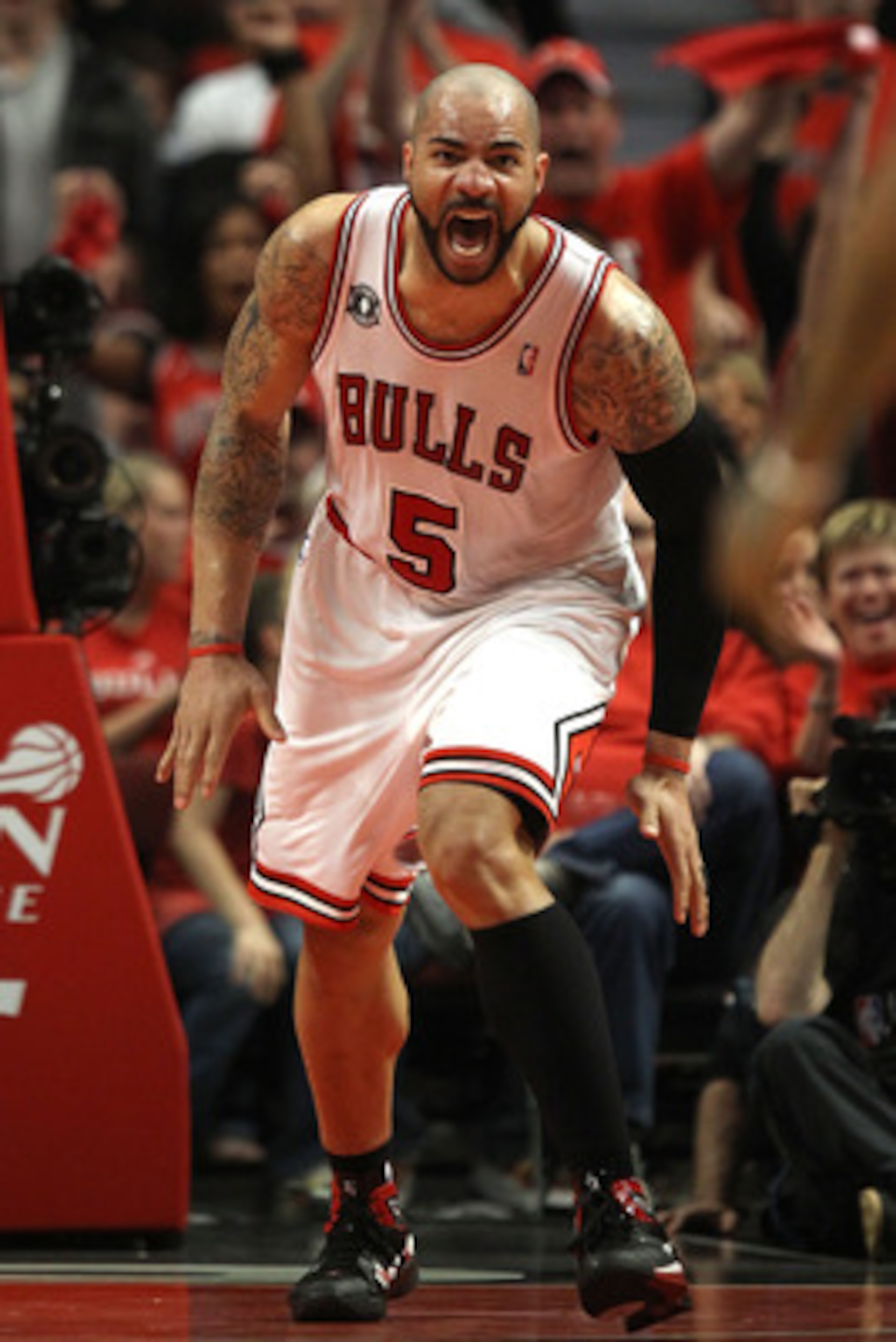 CHICAGO, IL - MAY 15: Carlos Boozer #5 of the Chicago Bulls reacts against the Miami Heat in Game One of the Eastern Conference Finals during the 2011 NBA Playoffs on May 15, 2011 at the United Center in Chicago, Illinois. NOTE TO USER: User expressly ack CHICAGO, IL - MAY 15: Carlos Boozer #5 of the Chicago Bulls reacts against the Miami Heat in Game One of the Eastern Conference Finals during the 2011 NBA Playoffs on May 15, 2011 at the United Center in Chicago, Illinois. NOTE TO USER: User expressly ack