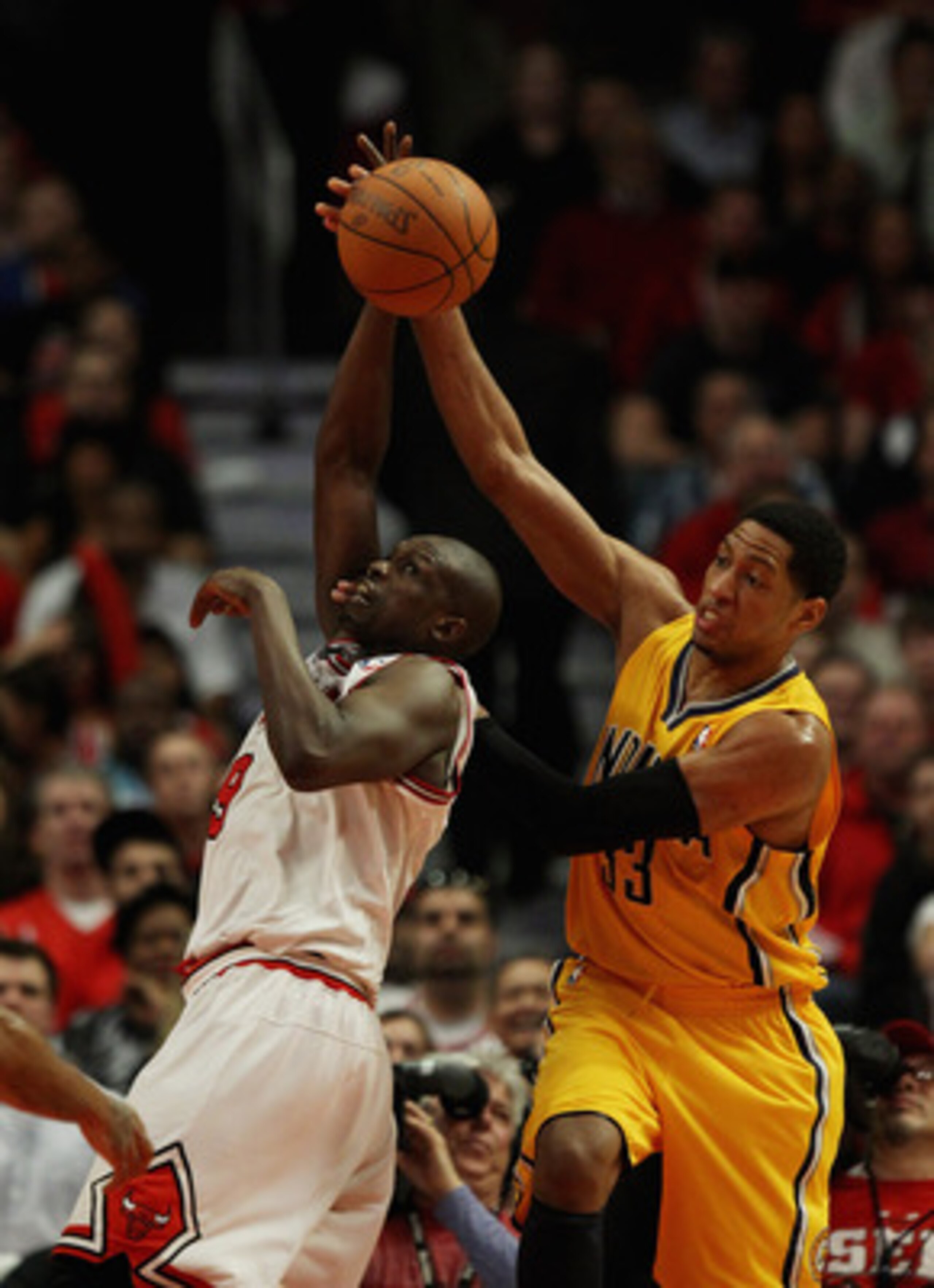 CHICAGO, IL - APRIL 26: Loul Deng #9 of the Chicago Bulls battles for a rebound with Danny Granger #33 of the Indiana Pacers in Game Five of the Eastern Conference Quarterfinals in the 2011 NBA Playoffs at the United Center on April 26, 2011 in Chicago, I CHICAGO, IL - APRIL 26: Loul Deng #9 of the Chicago Bulls battles for a rebound with Danny Granger #33 of the Indiana Pacers in Game Five of the Eastern Conference Quarterfinals in the 2011 NBA Playoffs at the United Center on April 26, 2011 in Chicago, I