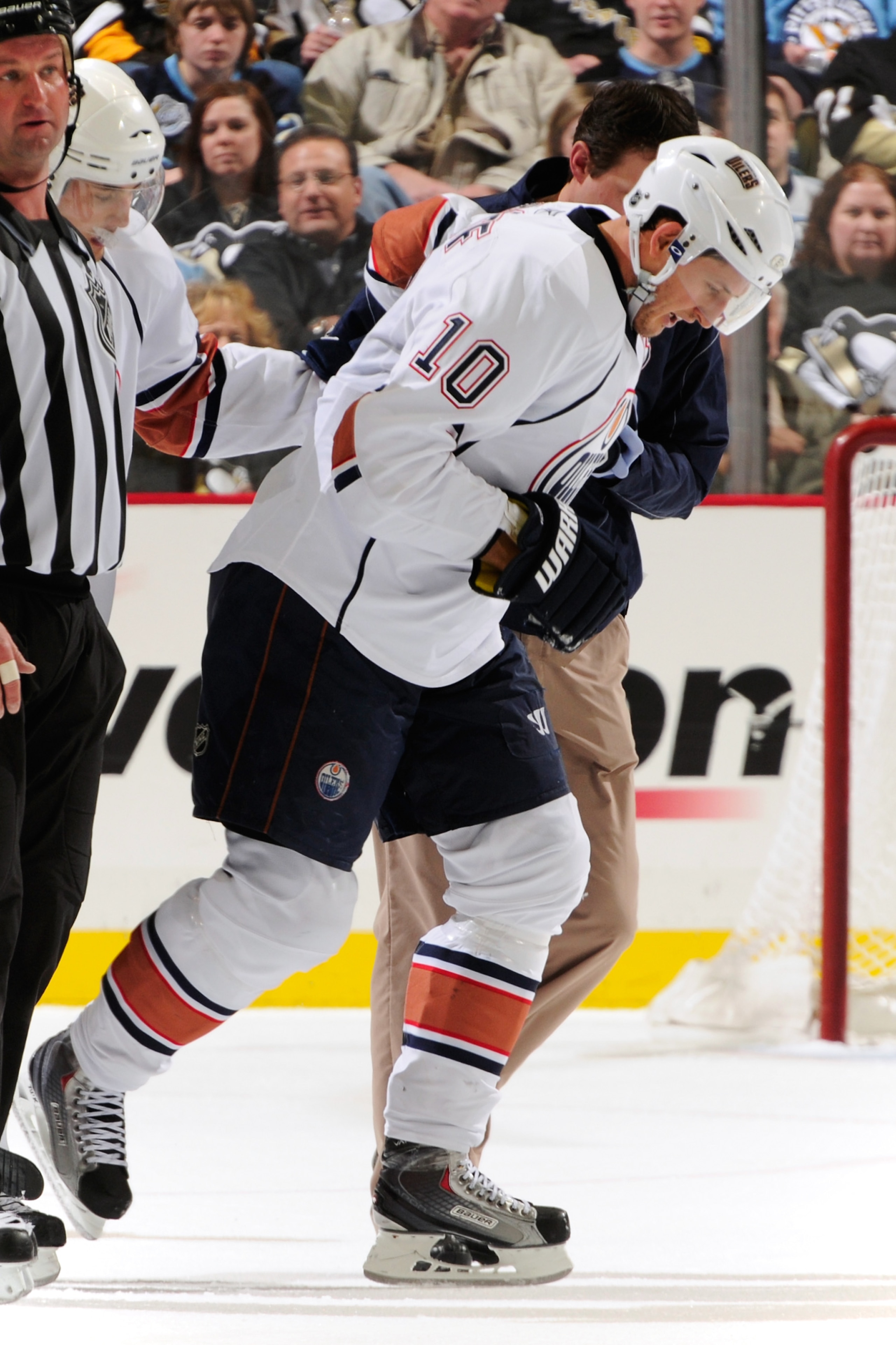 PITTSBURGH, PA - MARCH 13: Shawn Horcoff #10 of the Edmonton Oilers is helped off the ice after being struck with the puck in the third period against the Pittsburgh Penguins on March 13, 2011 at CONSOL Energy Center in Pittsburgh, Pennsylvania. (Photo PITTSBURGH, PA - MARCH 13: Shawn Horcoff #10 of the Edmonton Oilers is helped off the ice after being struck with the puck in the third period against the Pittsburgh Penguins on March 13, 2011 at CONSOL Energy Center in Pittsburgh, Pennsylvania. (Photo