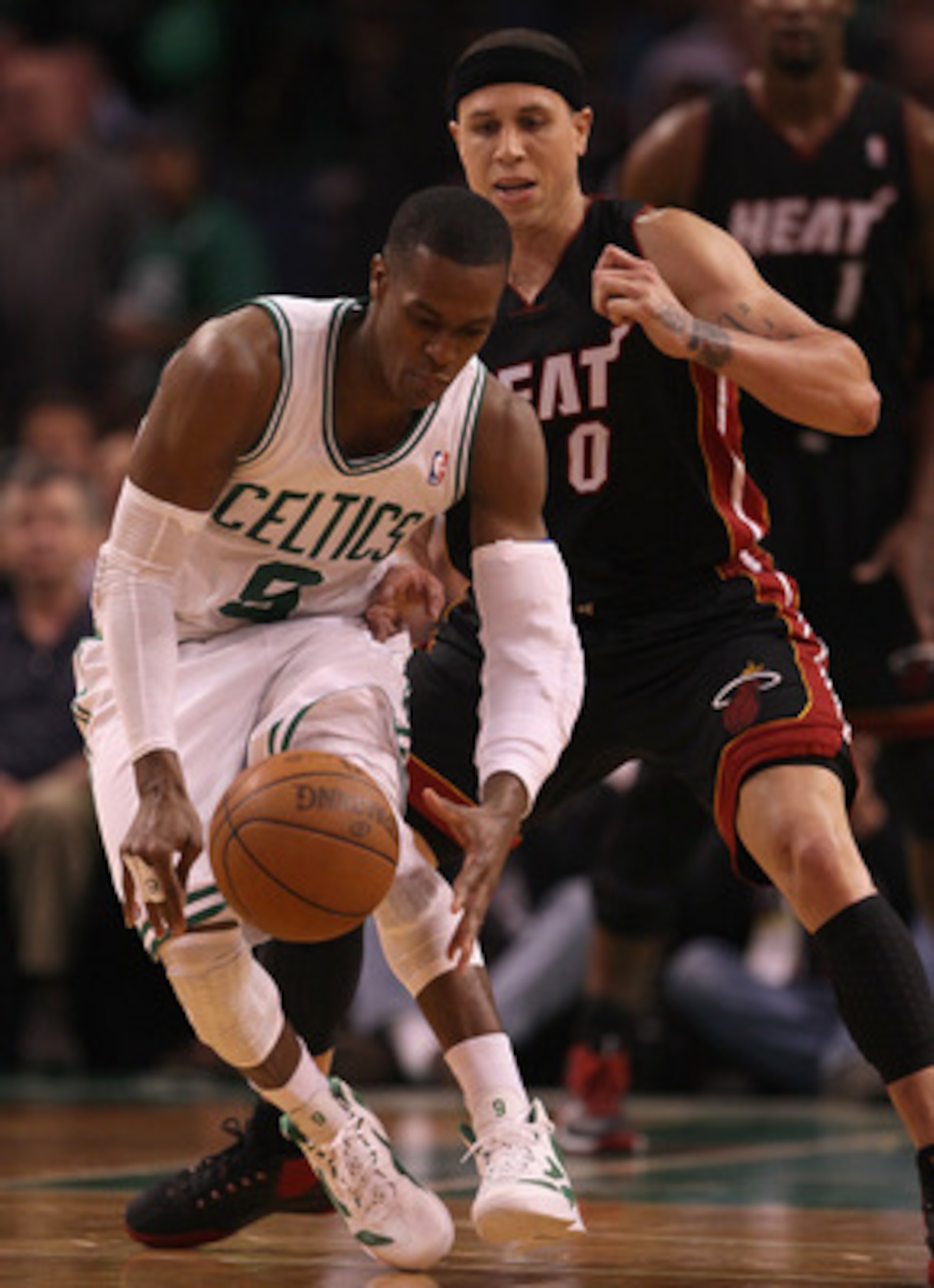 BOSTON, MA - MAY 09: Rajon Rondo #9 of the Boston Celtics tries to keep the ball from Mike Bibby #0 of the Miami Heat in Game Four of the Eastern Conference Semifinals in the 2011 NBA Playoffs on May 9, 2011 at the TD Garden in Boston, Massachusetts. Th BOSTON, MA - MAY 09: Rajon Rondo #9 of the Boston Celtics tries to keep the ball from Mike Bibby #0 of the Miami Heat in Game Four of the Eastern Conference Semifinals in the 2011 NBA Playoffs on May 9, 2011 at the TD Garden in Boston, Massachusetts. Th