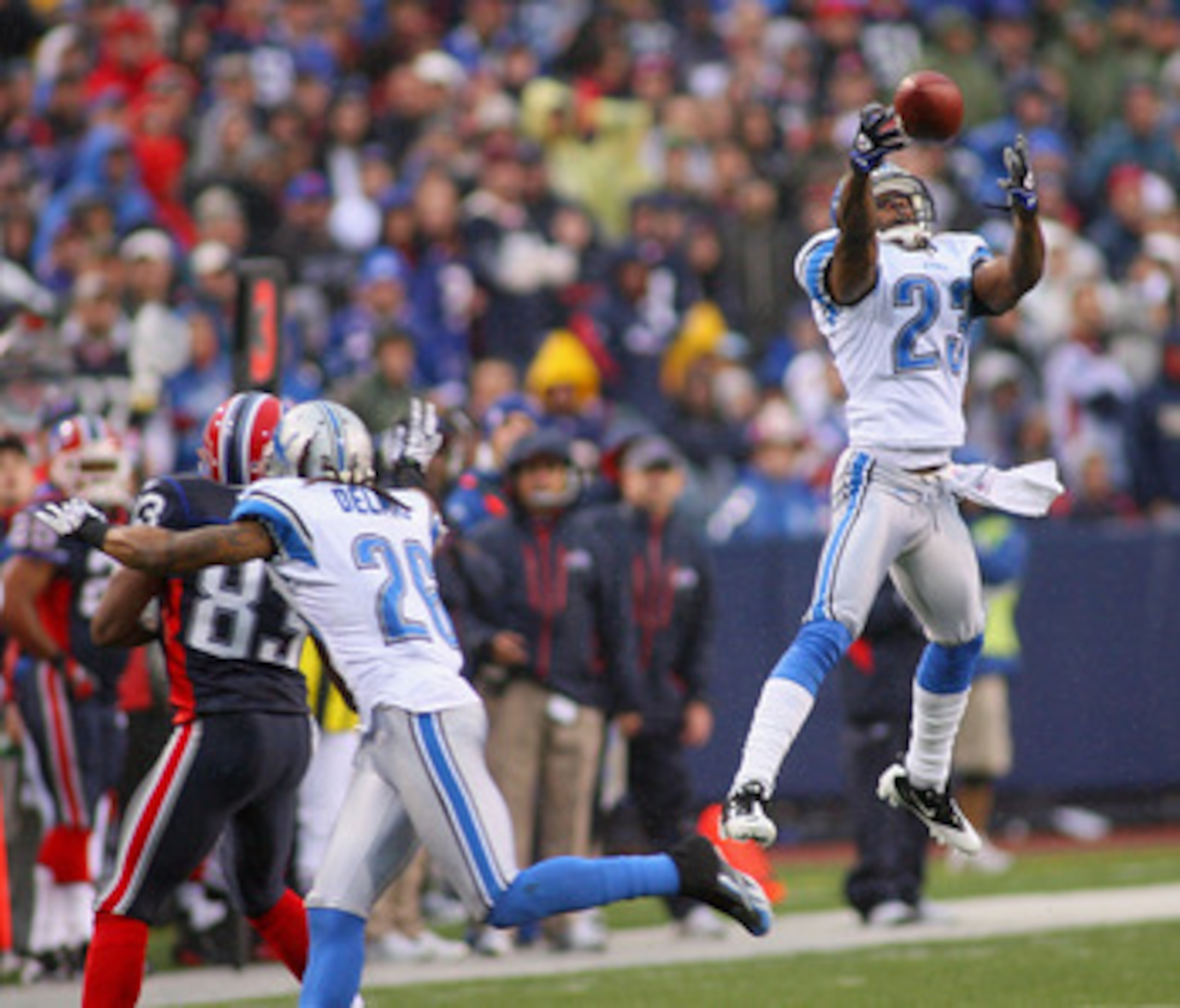 ORCHARD PARK, NY - NOVEMBER 14: Chris Houston #23 of the Detroit Lions unsuccesfully tries to intercept a pass intended for Lee Evans #83 of the Buffalo Bills  at Ralph Wilson Stadium on November 14, 2010 in Orchard Park, New York. Buffalo won 14-12. (Pho