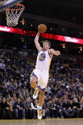 OAKLAND, CA - MARCH 25:  David Lee #10 of the Golden State Warriors in action against the Toronto Raptors at Oracle Arena on March 25, 2011 in Oakland, California. NOTE TO USER: User expressly acknowledges and agrees that, by downloading and or using this