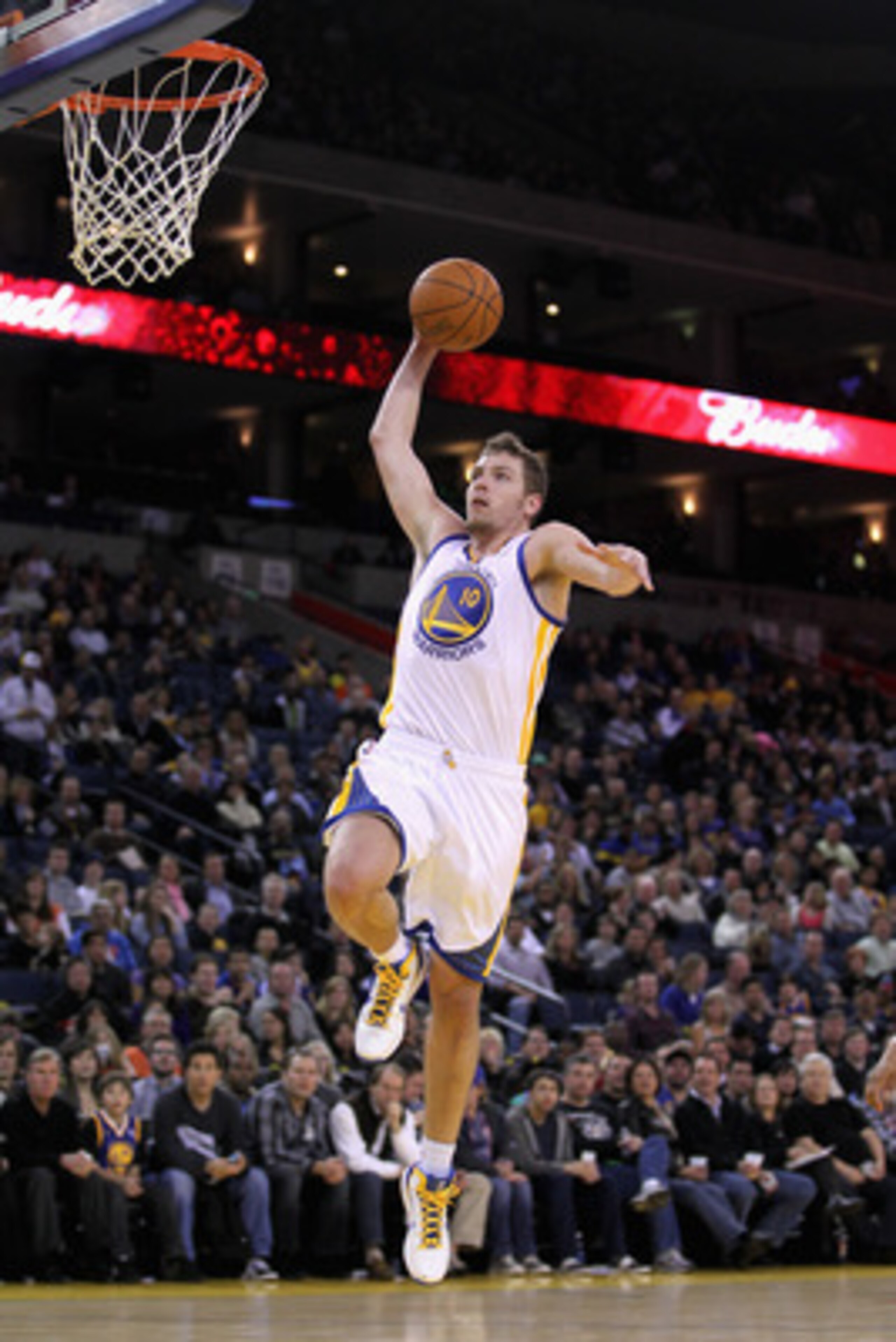 OAKLAND, CA - MARCH 25:  David Lee #10 of the Golden State Warriors in action against the Toronto Raptors at Oracle Arena on March 25, 2011 in Oakland, California. NOTE TO USER: User expressly acknowledges and agrees that, by downloading and or using this