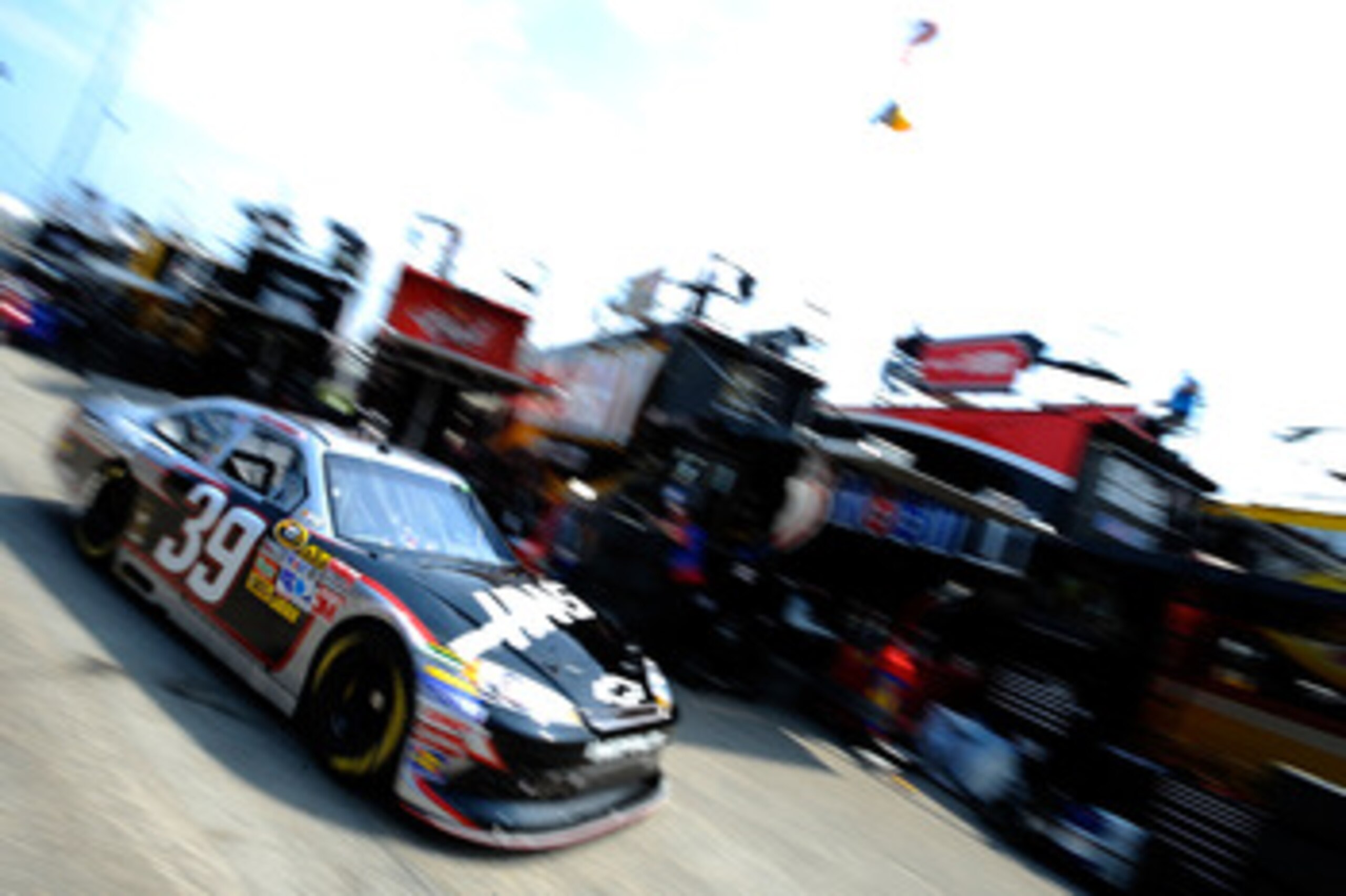 DOVER, DE - MAY 13: Ryan Newman drives the #39 Haas Automation Chevrolet through the garage area during practice for the NASCAR Sprint Cup Series FedEx 400 Benefiting Autism Speaks at Dover International Speedway on May 13, 2011 in Dover, Delaware. (Pho DOVER, DE - MAY 13: Ryan Newman drives the #39 Haas Automation Chevrolet through the garage area during practice for the NASCAR Sprint Cup Series FedEx 400 Benefiting Autism Speaks at Dover International Speedway on May 13, 2011 in Dover, Delaware. (Pho