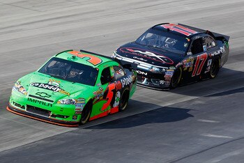 DOVER, DE - MAY 15: Mark Martin, driver of the #5 GoDaddy.com Chevrolet, races Matt Kenseth, driver of the #17 Wiley-X Ford, during the NASCAR Sprint Cup Series FedEx 400 Benefiting Autism Speaks at Dover International Speedway on May 15, 2011 in Dover, D