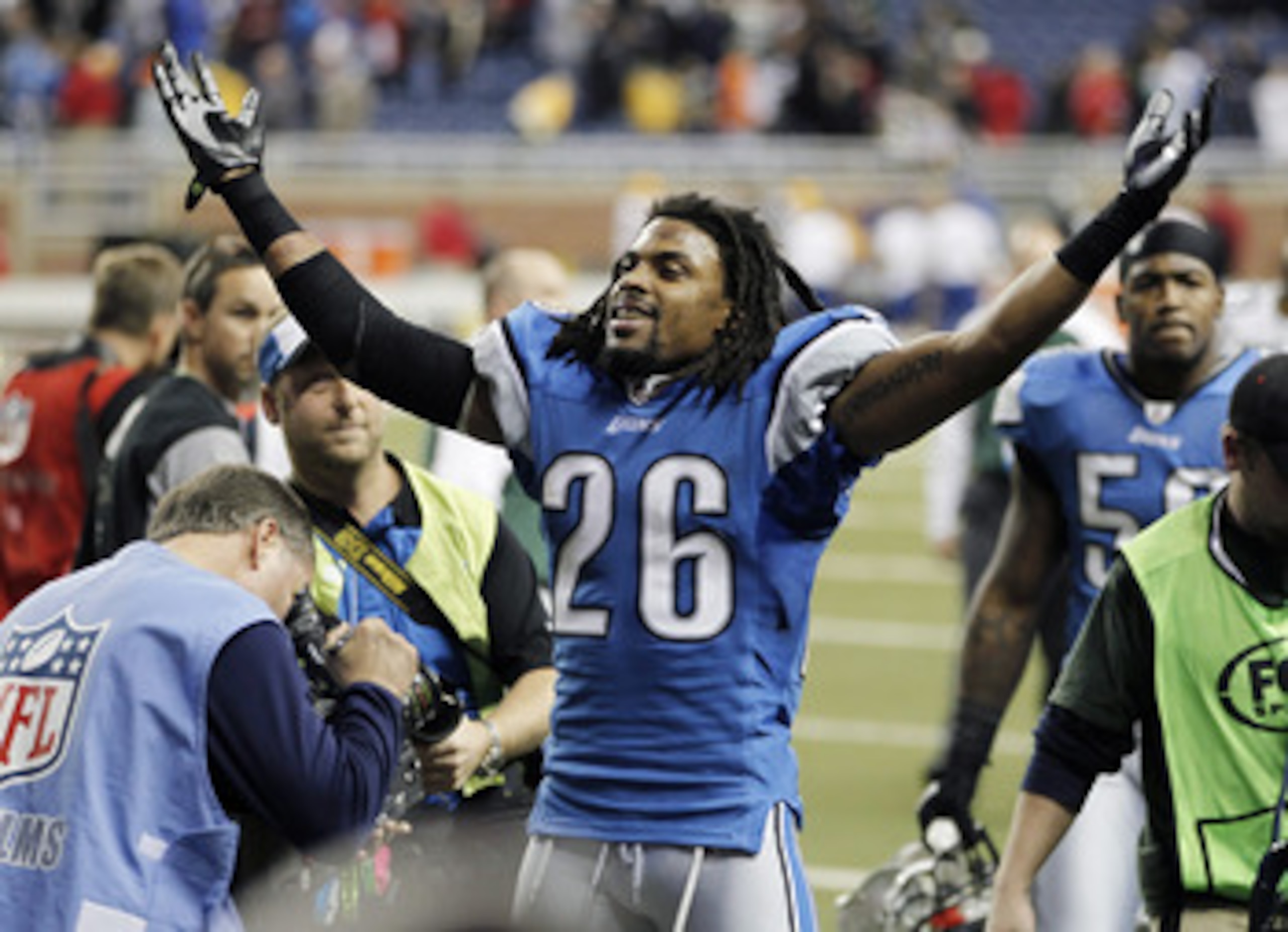 DETROIT, MI - DECEMBER 12:  Louis Delmas #26 of the Detroit Lions leaves the field celebrating a 7-3 victory over the Green Bay Packers on December 12, 2010 at Ford Field in Detroit, Michigan.  (Photo by Gregory Shamus/Getty Images)