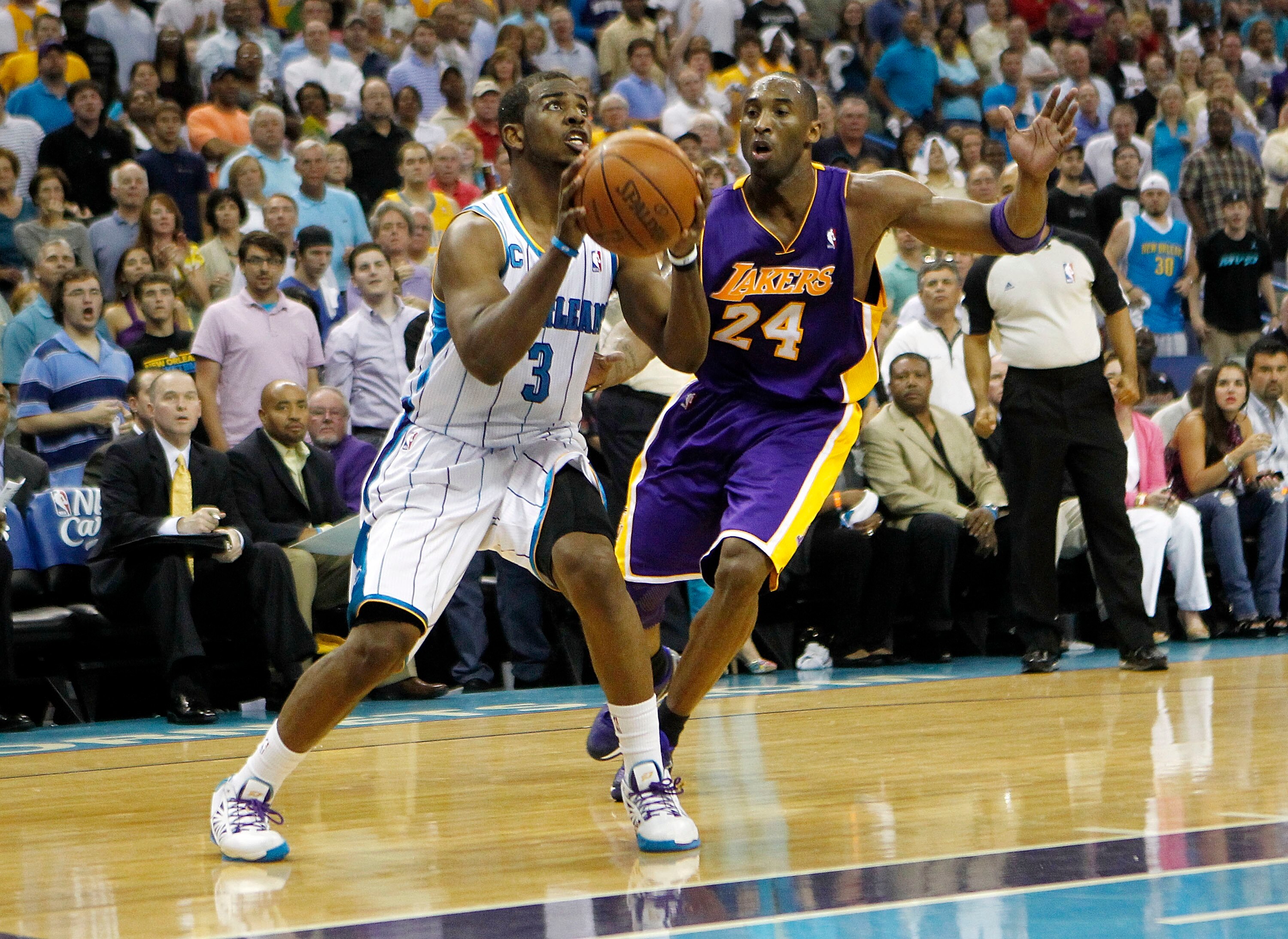 NEW ORLEANS - APRIL 24:  Chris Paul #3 of the New Orleans Hornets looks to shoot in front of Kobe Bryant #24 of the Los Angeles Lakers in Game Four of the Western Conference Quarterfinals in the 2011 NBA Playoffs at New Orleans Arena on April 24, 2011 in