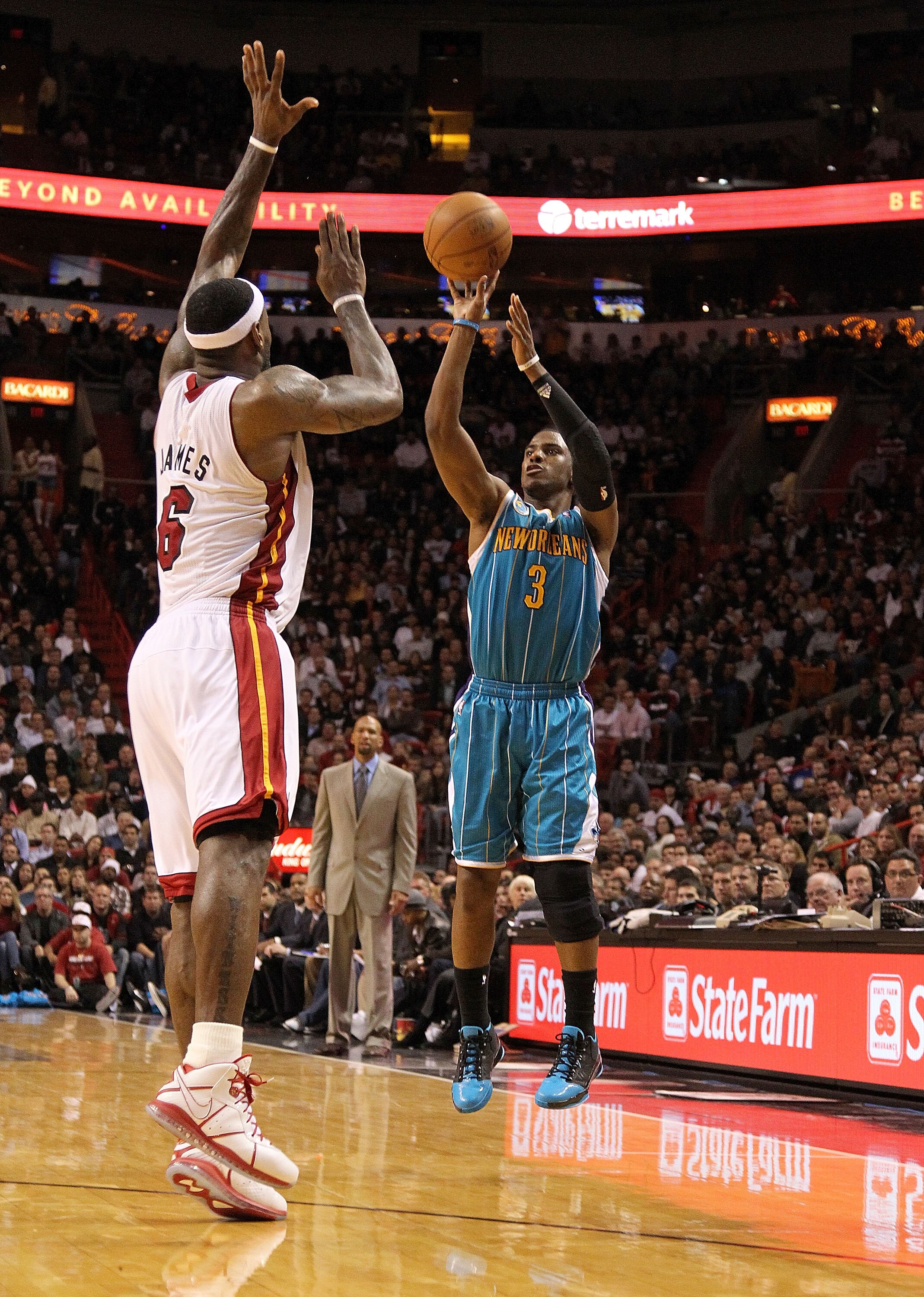 MIAMI, FL - DECEMBER 13:  Chris Paul #3 of the New Orleans Hornets shoots over LeBron James #6 of the Miami Heat during a foul shot during a game at American Airlines Arena on December 13, 2010 in Miami, Florida. NOTE TO USER: User expressly acknowledges