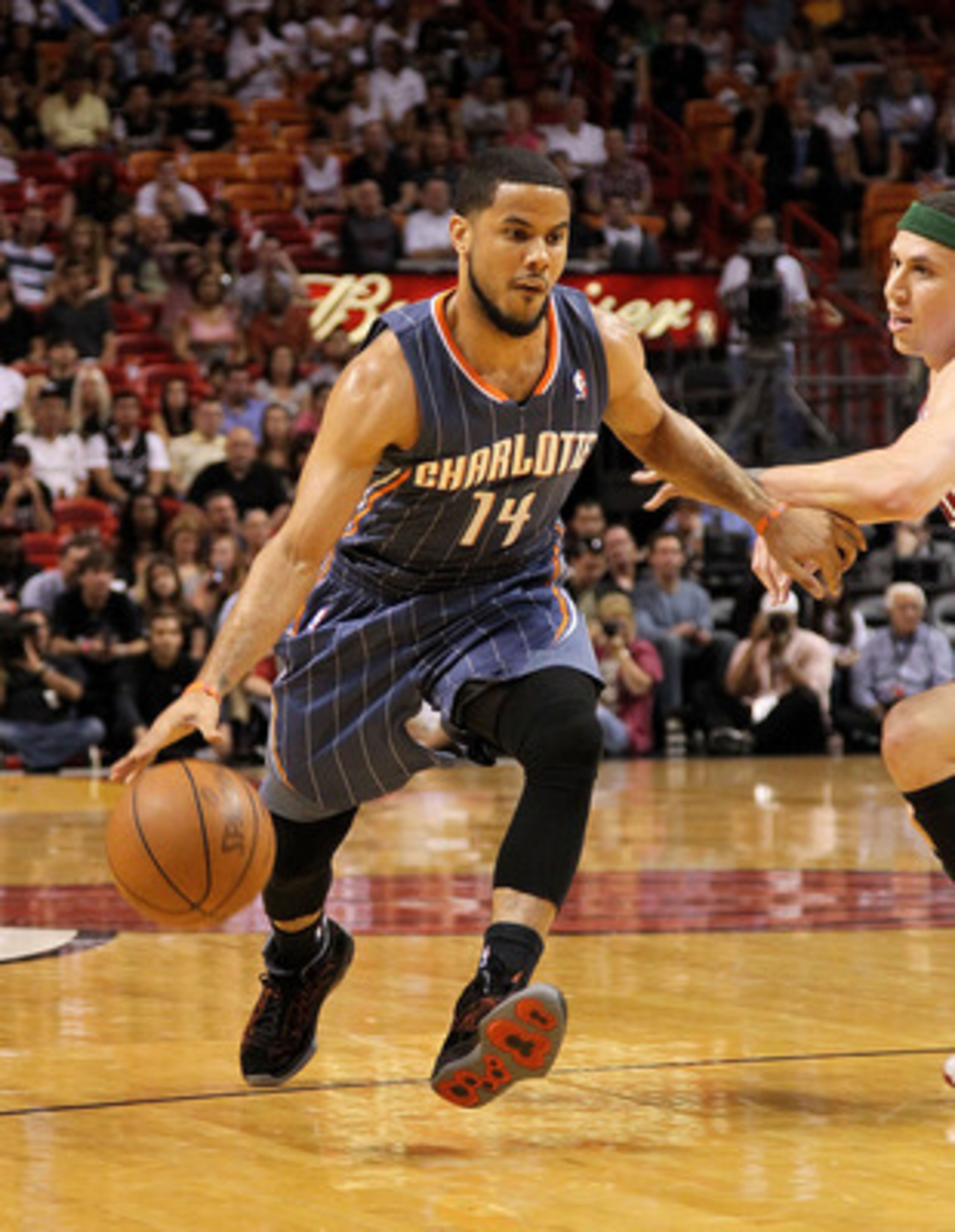 MIAMI, FL - APRIL 08: D.J. Augustin #14 of the Charlotte Bobcats drives to the lane during a game against the Miami Heat at American Airlines Arena on April 8, 2011 in Miami, Florida. NOTE TO USER: User expressly acknowledges and agrees that, by download MIAMI, FL - APRIL 08: D.J. Augustin #14 of the Charlotte Bobcats drives to the lane during a game against the Miami Heat at American Airlines Arena on April 8, 2011 in Miami, Florida. NOTE TO USER: User expressly acknowledges and agrees that, by download
