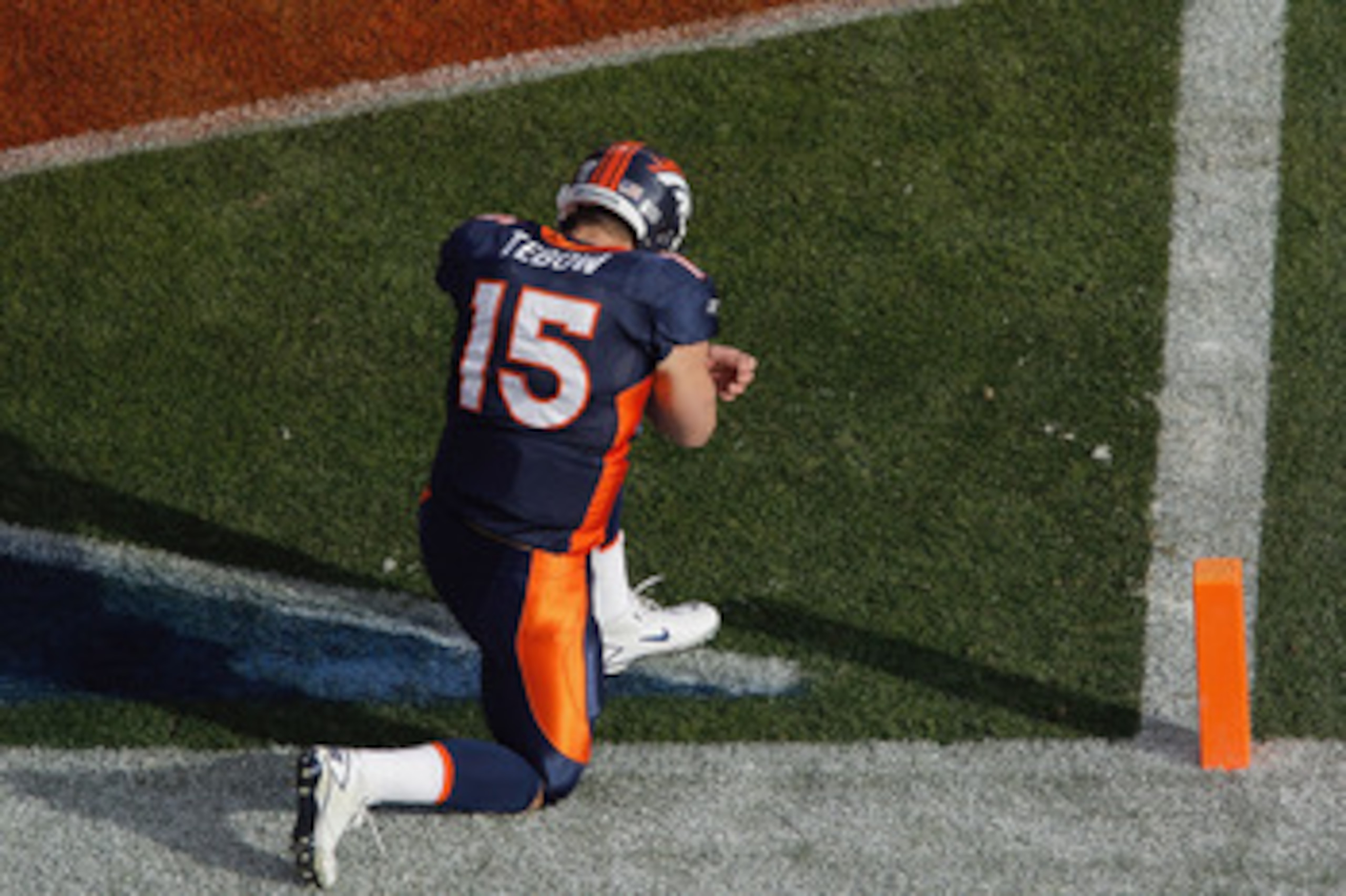 DENVER - DECEMBER 26:  Tim Tebow #15 of the Denver Broncos prays in the end zone prior to taking on the Houston Texans at INVESCO Field at Mile High on December 26, 2010 in Denver, Colorado. (Photo by Justin Edmonds/Getty Images)