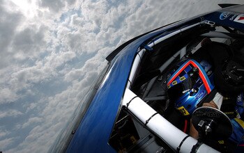 DOVER, DE - MAY 13:  A.J. Allmendinger, driver of the #43 Best Buy Ford, sits in his car during practice for the NASCAR Sprint Cup Series FedEx 400 Benefiting Autism Speaks at Dover International Speedway on May 13, 2011 in Dover, Delaware.  (Photo by Nic