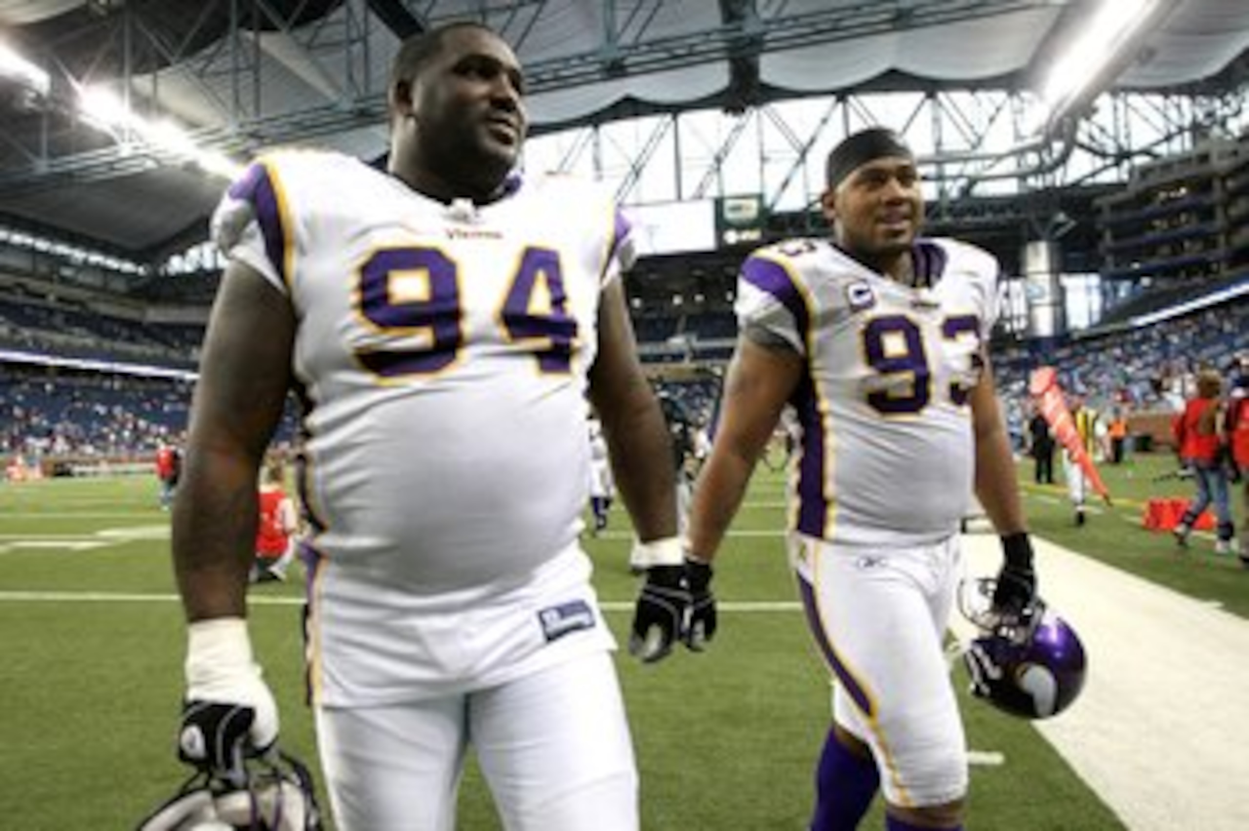 DETROIT - SEPTEMBER 20:  Defensive linemen Pat Williams #94 and Kevin Williams #93 of the Minnesota Vikings walk off the field after the game with the Detroit Lions at Ford Field on September 20, 2009 in Detroit, Michigan. The Vikings won 27-13.  (Photo b