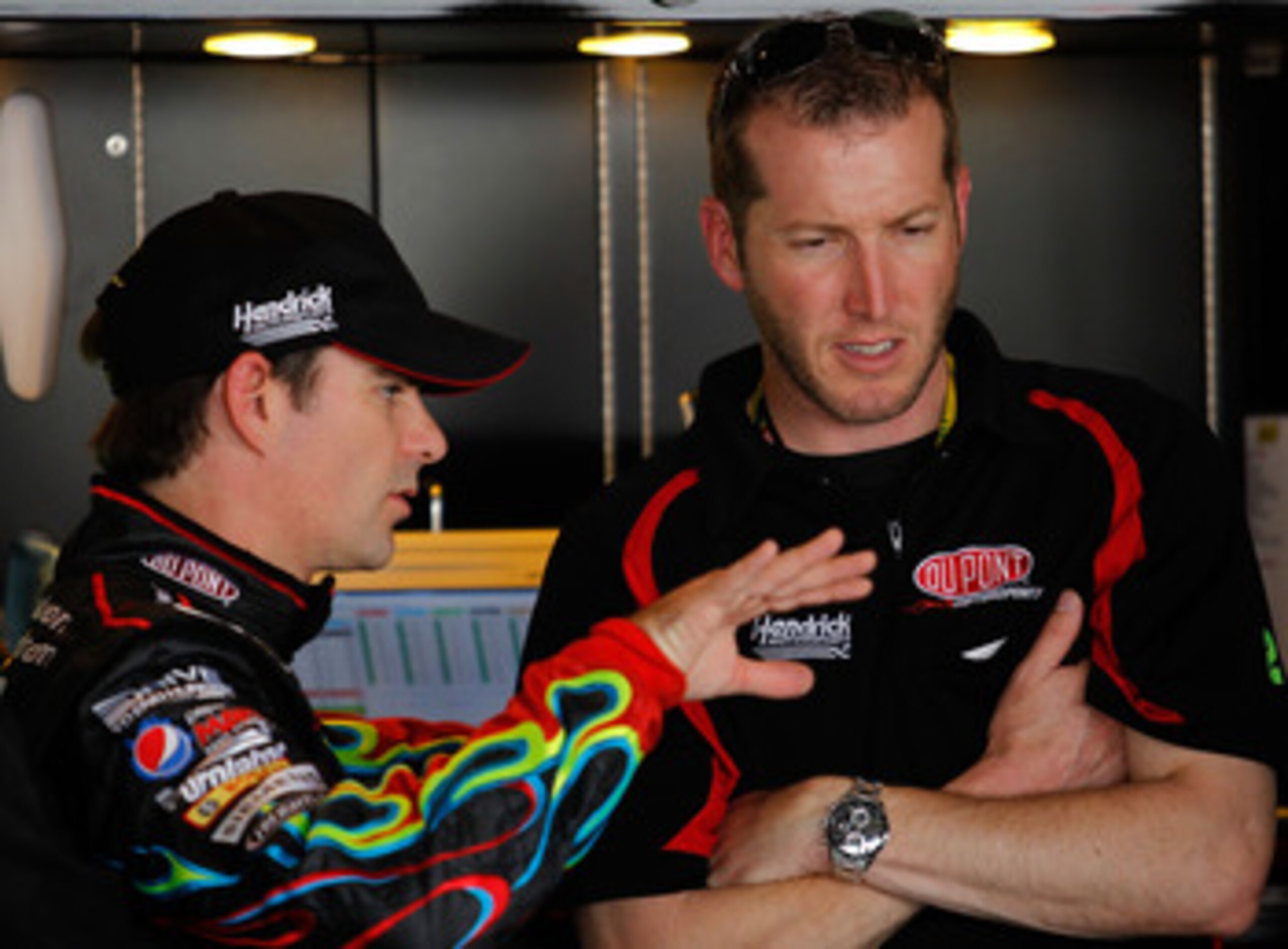DOVER, DE - MAY 13: Jeff Gordon (L), driver of the #24 DuPont Chevrolet, talks with crew cheif Alan Gustafson (R) in the garage during practice for the NASCAR Sprint Cup Series FedEx 400 Benefiting Autism Speaks at Dover International Speedway on May 13, DOVER, DE - MAY 13: Jeff Gordon (L), driver of the #24 DuPont Chevrolet, talks with crew cheif Alan Gustafson (R) in the garage during practice for the NASCAR Sprint Cup Series FedEx 400 Benefiting Autism Speaks at Dover International Speedway on May 13,
