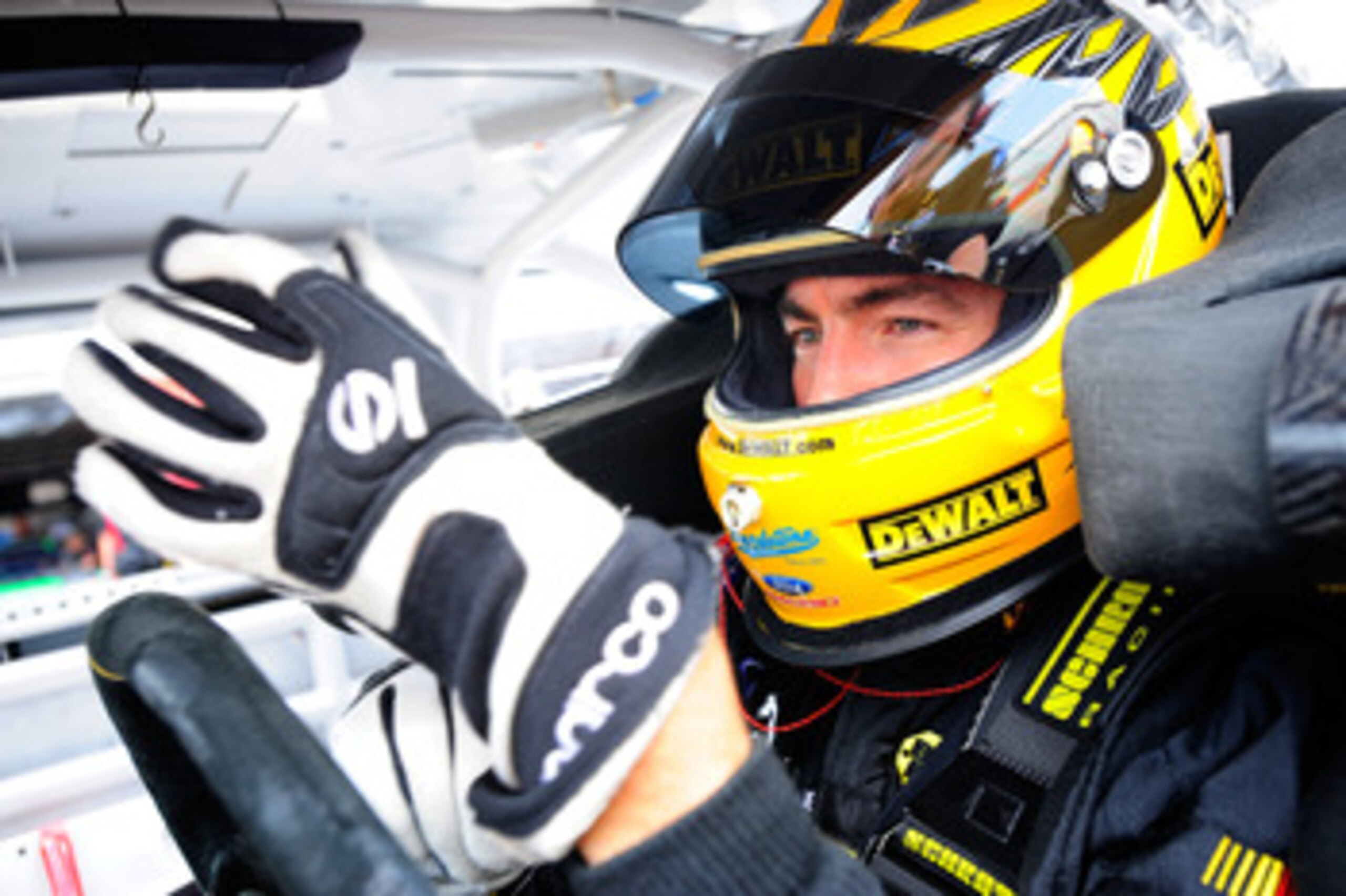 DOVER, DE - MAY 13: Marcos Ambrose, driver of the #9 Dewalt Ford, prepares for practice for the NASCAR Sprint Cup Series FedEx 400 Benefiting Autism Speaks at Dover International Speedway on May 13, 2011 in Dover, Delaware. (Photo by Jason Smith/Getty I DOVER, DE - MAY 13: Marcos Ambrose, driver of the #9 Dewalt Ford, prepares for practice for the NASCAR Sprint Cup Series FedEx 400 Benefiting Autism Speaks at Dover International Speedway on May 13, 2011 in Dover, Delaware. (Photo by Jason Smith/Getty I