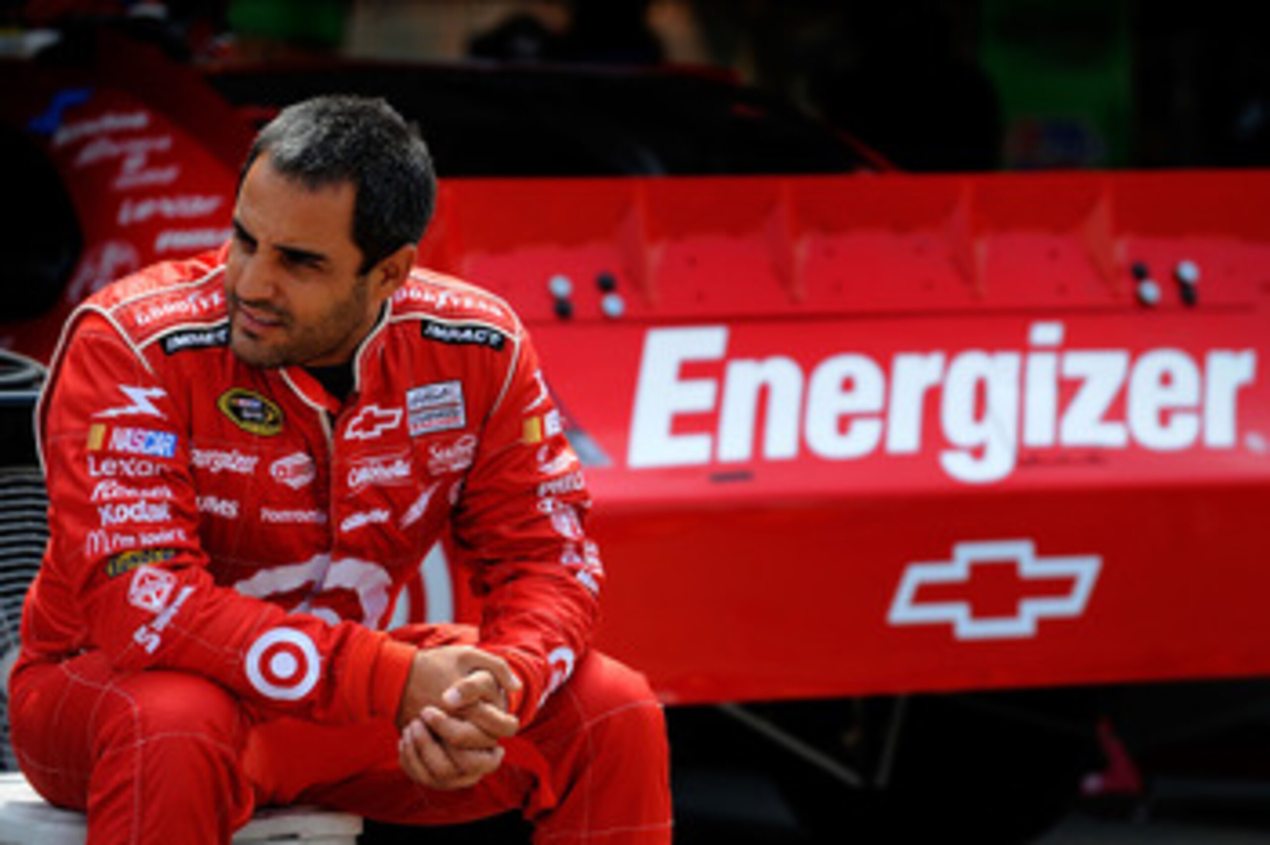 DOVER, DE - MAY 13: Juan Pablo Montoya, driver of the #42 Target Chevrolet, sits in the garage area during practice for the NASCAR Sprint Cup Series FedEx 400 Benefiting Autism Speaks at Dover International Speedway on May 13, 2011 in Dover, Delaware. ( DOVER, DE - MAY 13: Juan Pablo Montoya, driver of the #42 Target Chevrolet, sits in the garage area during practice for the NASCAR Sprint Cup Series FedEx 400 Benefiting Autism Speaks at Dover International Speedway on May 13, 2011 in Dover, Delaware. (