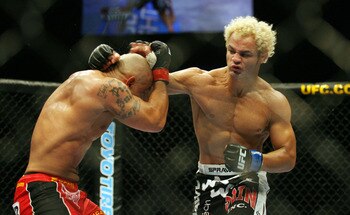 CHICAGO- OCTOBER 25: Josh Koscheck (R) punches Thiago Alves in a Welterweight bout  at UFC's Ultimate Fight Night at Allstate Arena on October 25, 2008 in Chicago, Illinois. (Photo by Tasos Katopodis/Getty Images)