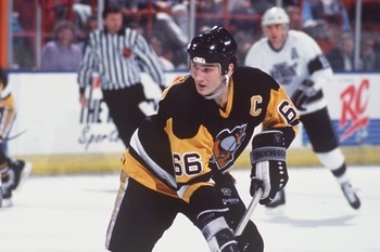 MARIO LEMIEUX OF PITTSBURGH CONTROLS THE PUCK DURING THE PENGUINS GAME VERSUS THE LOS ANGELES KINGS AT THE GREAT WESTERN FORUM IN INGLEWOOD, CALIFORNIA.