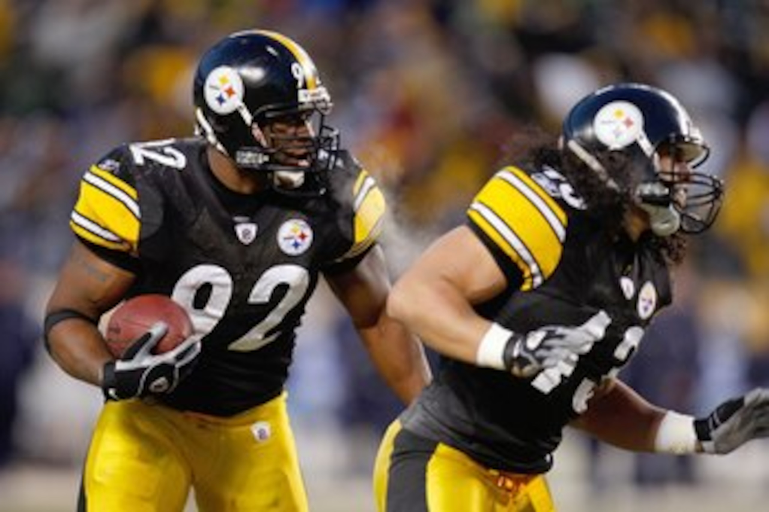 PITTSBURGH - DECEMBER 7:  James Harrison #92 of the Pittsburgh Steelers runs with the ball after a fumble recovery during their NFL game against the Dallas Cowboys on December 7, 2008 at Heinz Field in Pittsburgh, Pennsylvania. The Steelers defeated the C