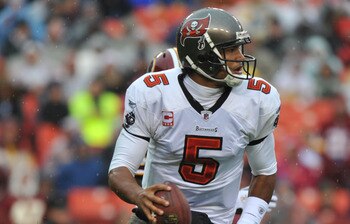 LANDOVER, MD - DECEMBER 12:  Josh Freeman #5 of the Tampa Bay Buccaneers scrambles during the game against the Washington Redskins  at FedExField on December 12, 2010 in Landover, Maryland. The Buccaneers defeated the Redskins 17-16. (Photo by Larry Frenc