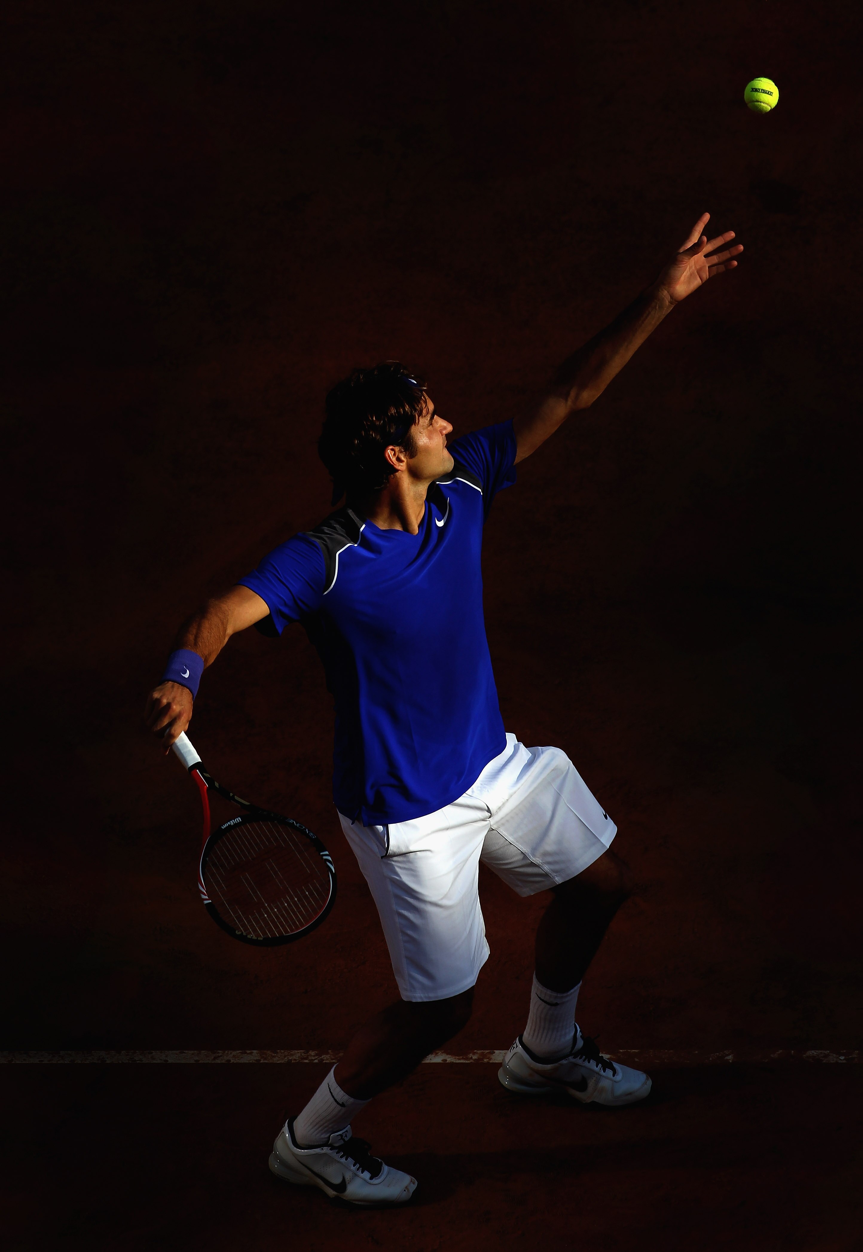 ROME, ITALY - MAY 12:  Roger Federer of Switzerland serves during his third round match against Richard Gasquet of France during day five of the Internazionali BNL d'Italia at the Foro Italico Tennis Centre on May 12, 2011 in Rome, Italy.  (Photo by Alex