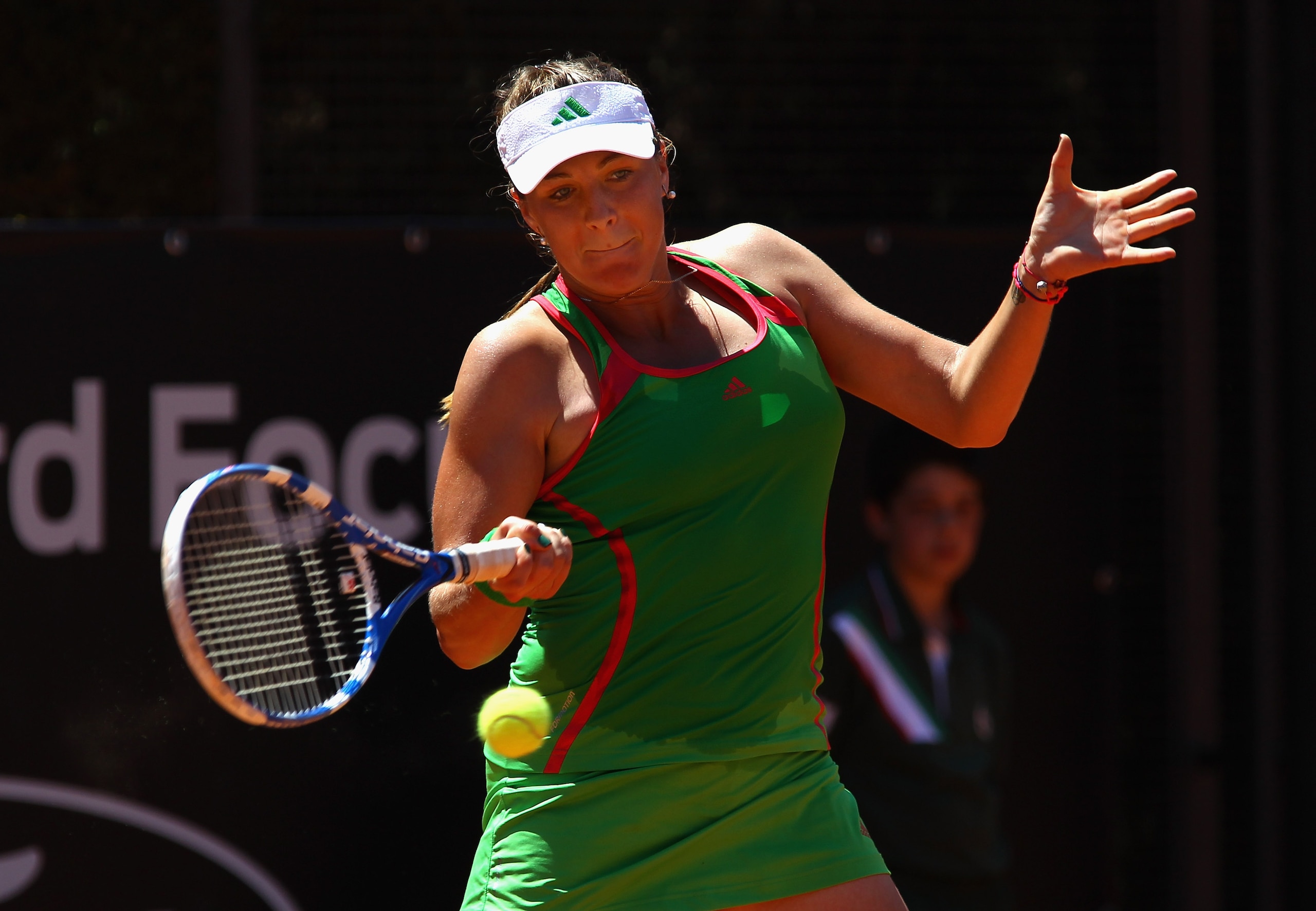 ROME, ITALY - MAY 11:  Anastasia Pavlyuchenkova of Russia plays a forehand return during her second round match against Vera Dushevina of Russia during day four of the Internazionali BNL d'Italia at the Foro Italico Tennis Centreon May 11, 2011 in Rome, I