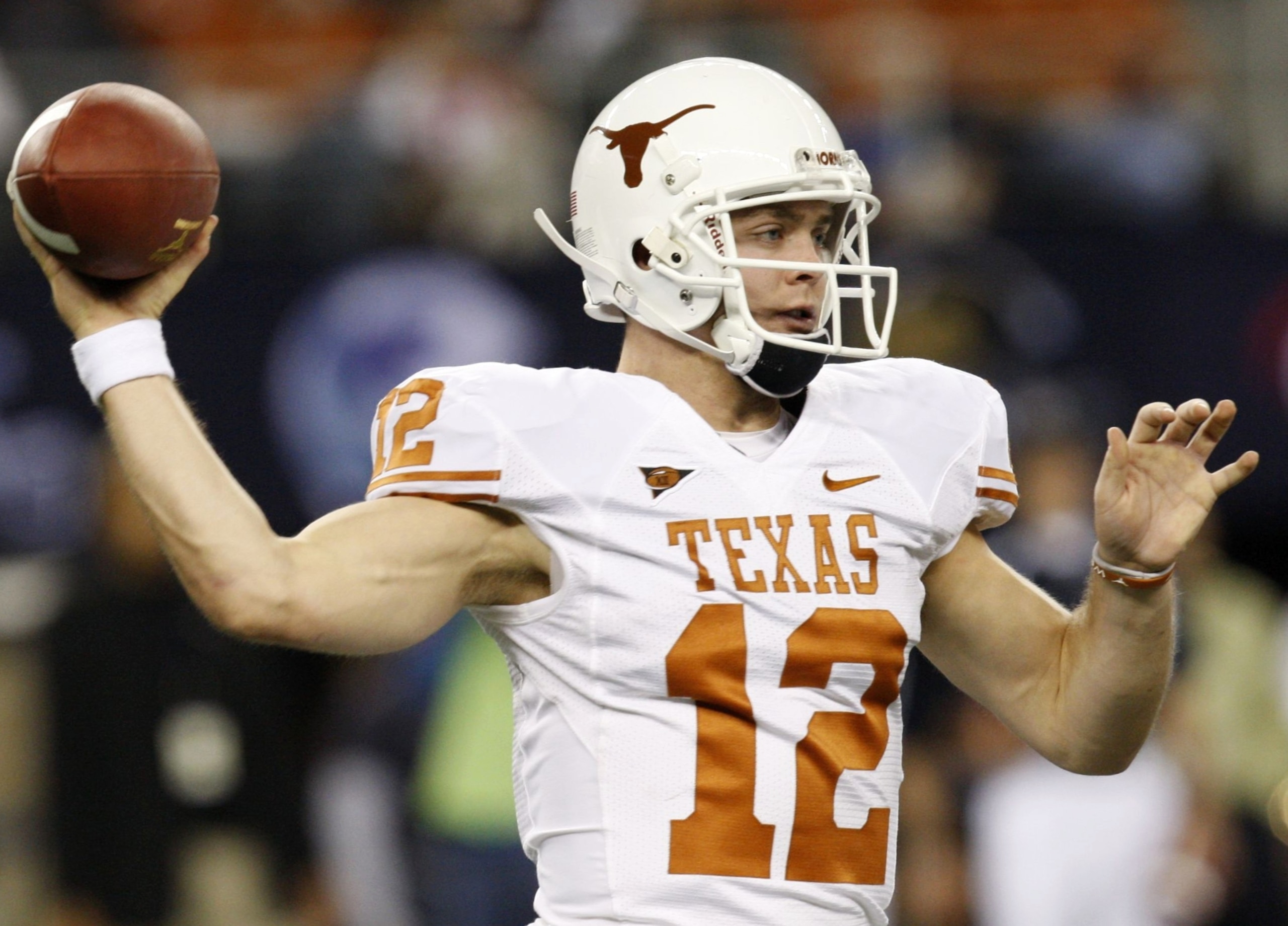 ARLINGTON, TX - DECEMBER 5:  Quarterback Colt McCoy #12 of the Texas Longhorns passes the ball against the Nebraska Cornhuskers at Cowboys Stadium on December 5, 2009 in Arlington, Texas.  (Photo by Ronald Martinez/Getty Images)