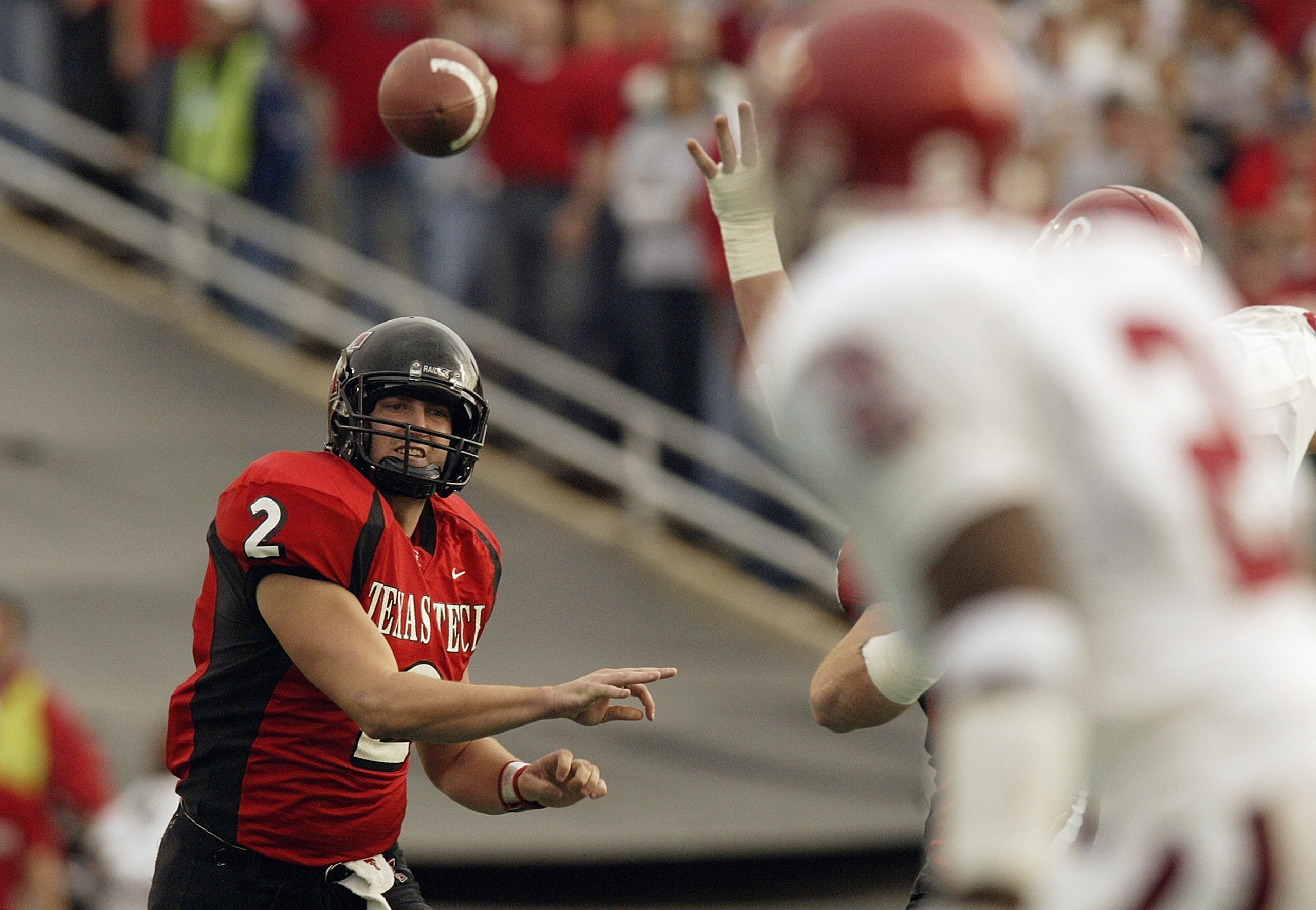 LUBBOCK, TX -NOVEMBER 22:  Quarterback B.J. Symons #2 of the Texas Tech Red Raiders throws a pass during the game against the Oklahoma Sooners at Jones SBC Stadium on November 22, 2003 in Lubbock, Texas.  The Sooners won 56-25.  (Photo by Ronald Martinez/