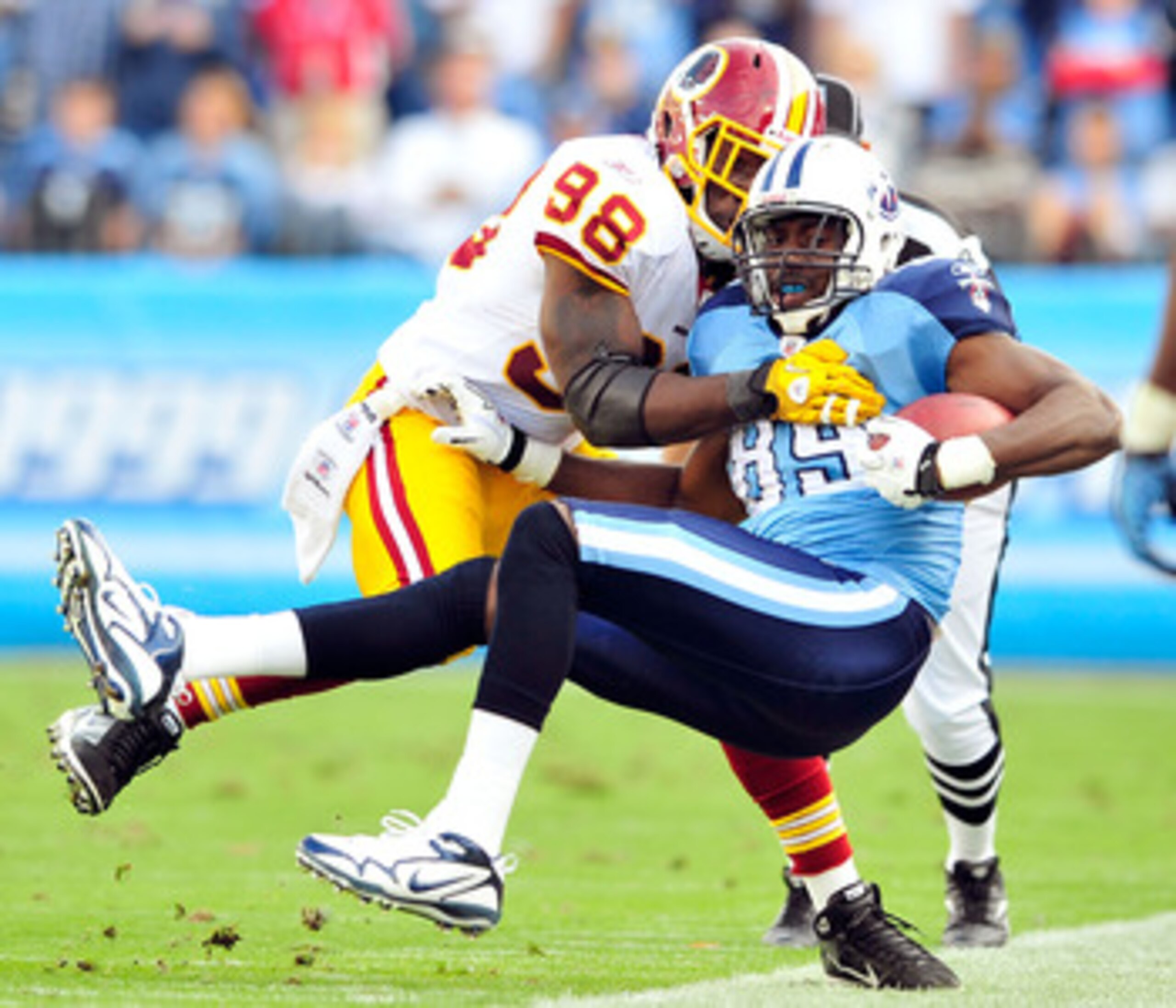 NASHVILLE, TN - NOVEMBER 21: Brian Orakpo #98 of the Washington Redskins forces Jared Cook #89 of the Tennessee Titans out-of-bounds at LP Field on November 21, 2010 in Nashville, Tennessee. The Redskins won 19-16 in overtime. (Photo by Grant Halverson/ NASHVILLE, TN - NOVEMBER 21: Brian Orakpo #98 of the Washington Redskins forces Jared Cook #89 of the Tennessee Titans out-of-bounds at LP Field on November 21, 2010 in Nashville, Tennessee. The Redskins won 19-16 in overtime. (Photo by Grant Halverson/