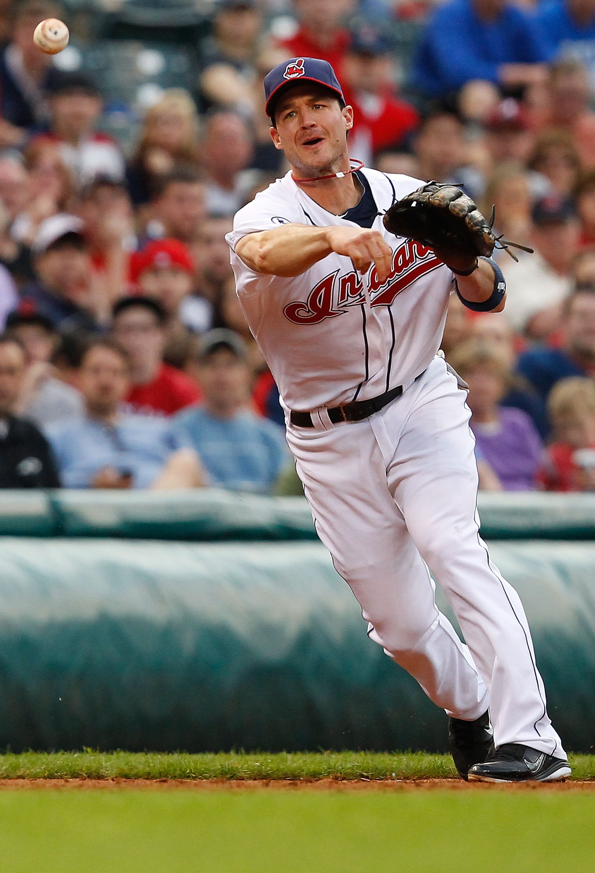 CLEVELAND - MAY 11:  Jack Hannahan #9 of the Cleveland Indians throws to first base against the Tampa Bay Rays during the game on May 11, 2011 at Progressive Field in Cleveland, Ohio.  (Photo by Jared Wickerham/Getty Images)