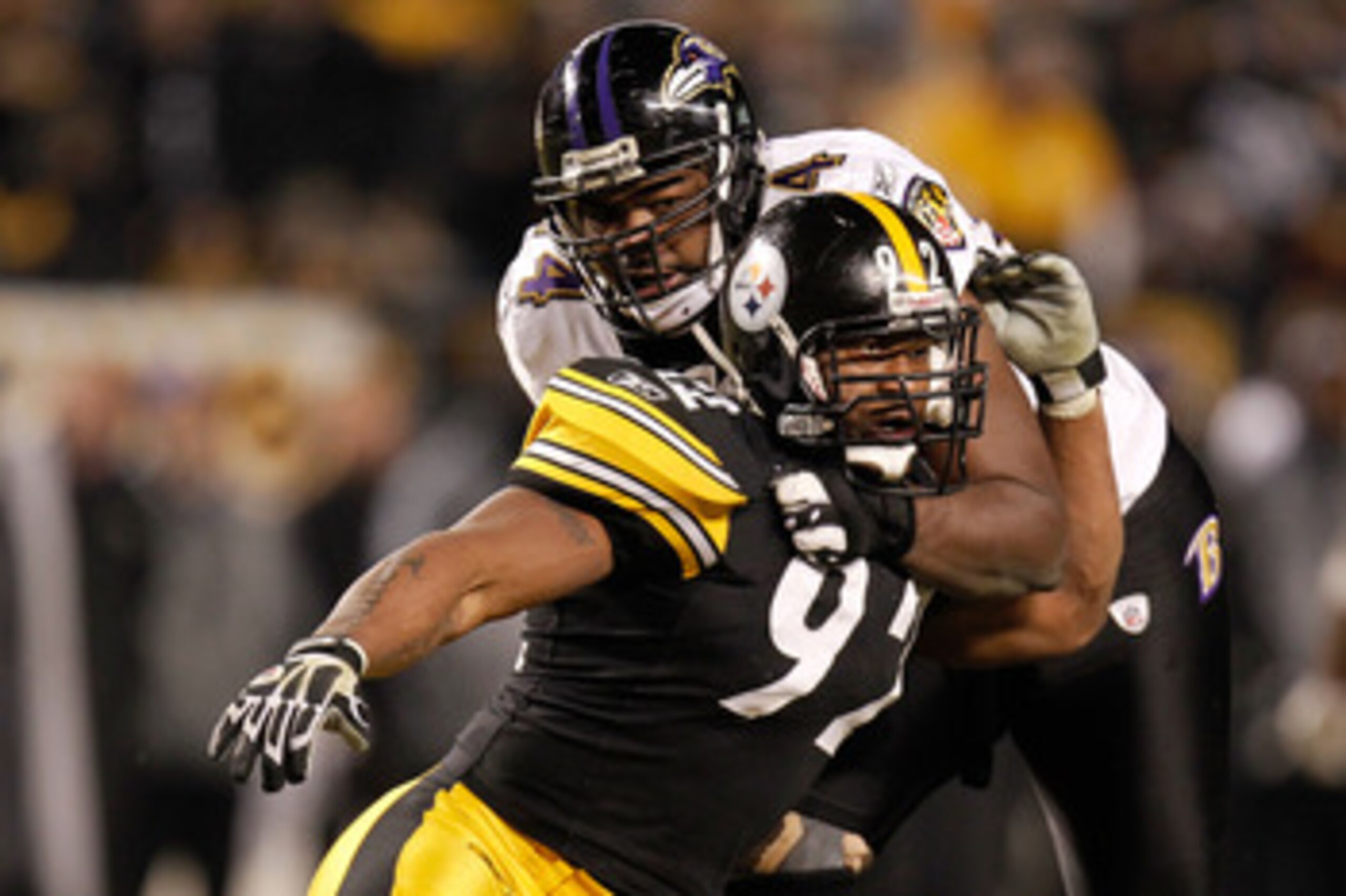 PITTSBURGH, PA - JANUARY 15: Linebacker James Harrison #92 of the Pittsburgh Steelers rushes against offensive tackle Michael Oher #74 of the Baltimore Ravens during the AFC Divisional Playoff Game at Heinz Field on January 15, 2011 in Pittsburgh, Pennsy PITTSBURGH, PA - JANUARY 15: Linebacker James Harrison #92 of the Pittsburgh Steelers rushes against offensive tackle Michael Oher #74 of the Baltimore Ravens during the AFC Divisional Playoff Game at Heinz Field on January 15, 2011 in Pittsburgh, Pennsy