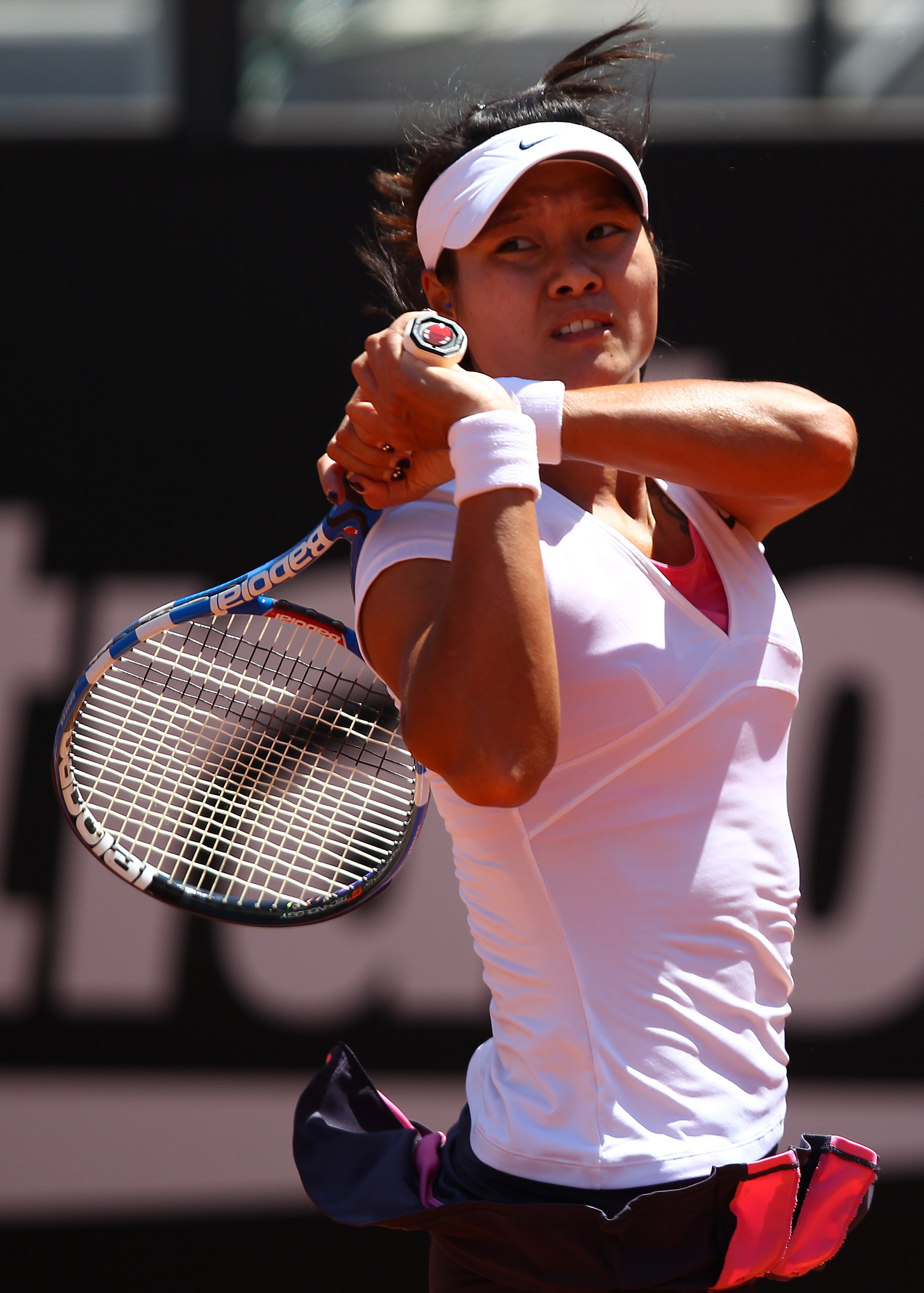ROME, ITALY - MAY 14:  Li Na of China in action during her semi final match against Sam Stosur of Australia during day seven of the Internazoinali BNL D'Italia at the Foro Italico Tennis Centre  on May 14, 2011 in Rome, Italy.  (Photo by Clive Brunskill/G