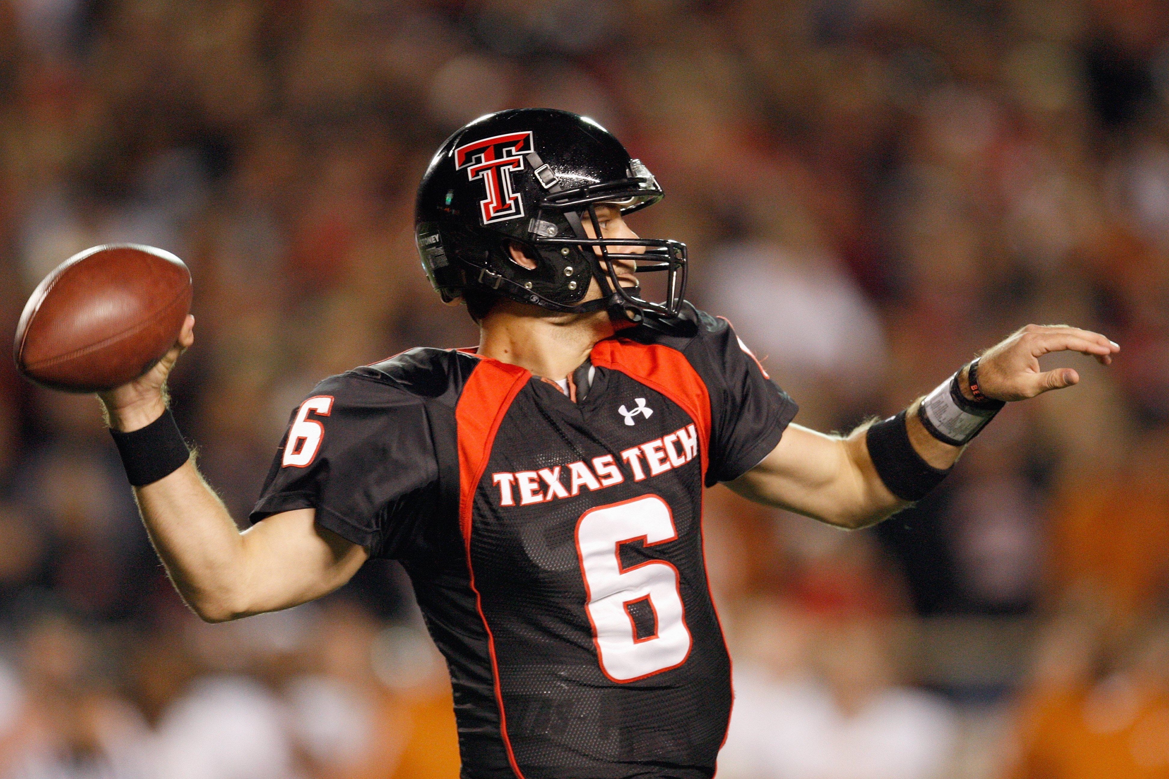 LUBBOCK, TEXAS - NOVEMBER 1:  Quarterback Graham Harrell #6 of the Texas Tech Red Raiders looks to pass the ball down the field during the game against the Texas Longhorns on November 1, 2008 at Jones Stadium in Lubbock, Texas. (Photo by: Jamie Squire/Get