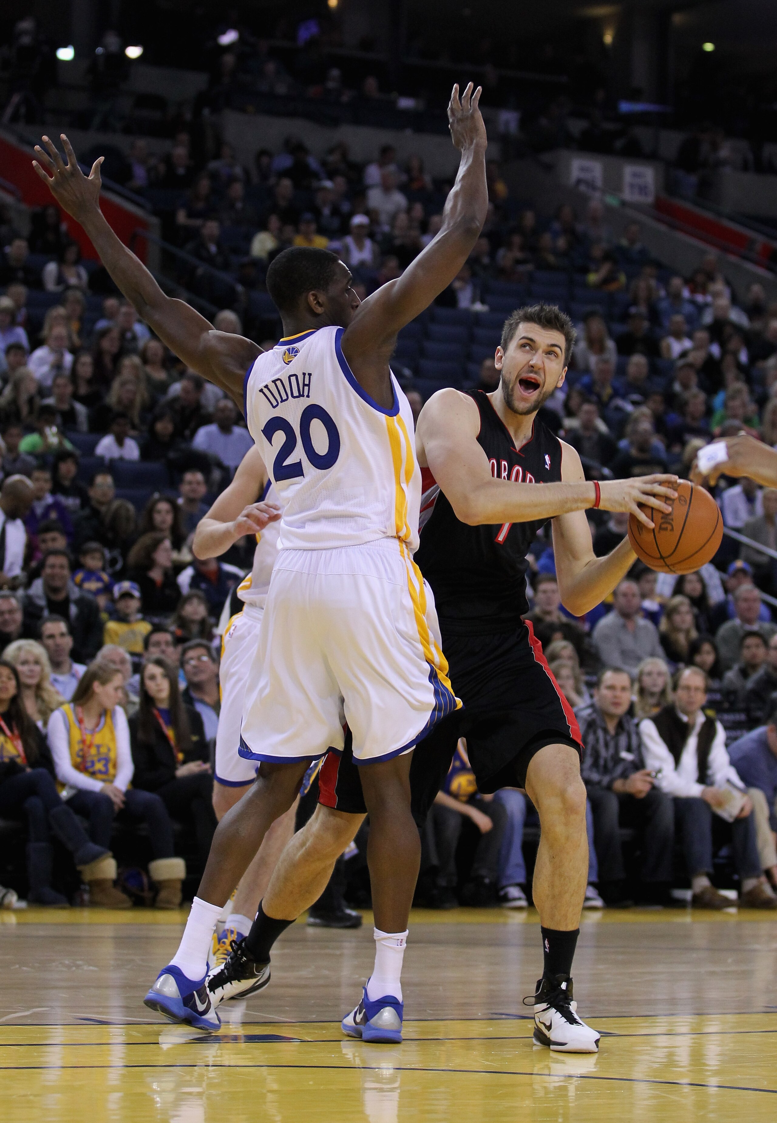 OAKLAND, CA - MARCH 25: Andrea Bargnani #7 of the Toronto Raptors is guarded by Ekpe Udoh #20 of the Golden State Warriors at Oracle Arena on March 25, 2011 in Oakland, California. NOTE TO USER: User expressly acknowledges and agrees that, by downloading