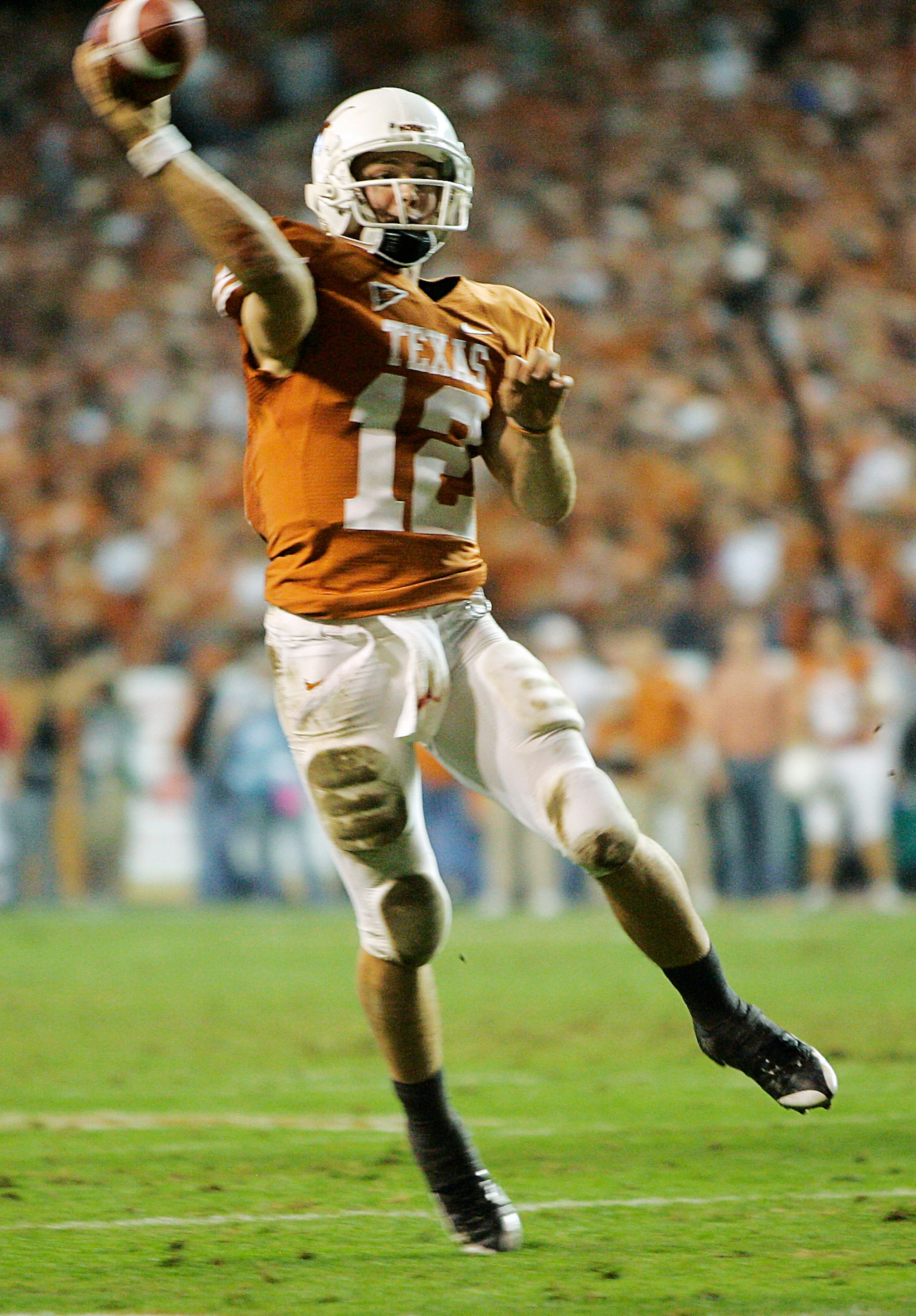AUSTIN, TX - NOVEMBER 27:  Quarterback Colt McCoy #12 of the Texas Longhorns throws a touchdown to teammate wide receiver Quan Cosby #6 against the Texas A&M Aggies in the final minute of the second quarter at Darrell K Royal-Texas Memorial Stadium Novemb