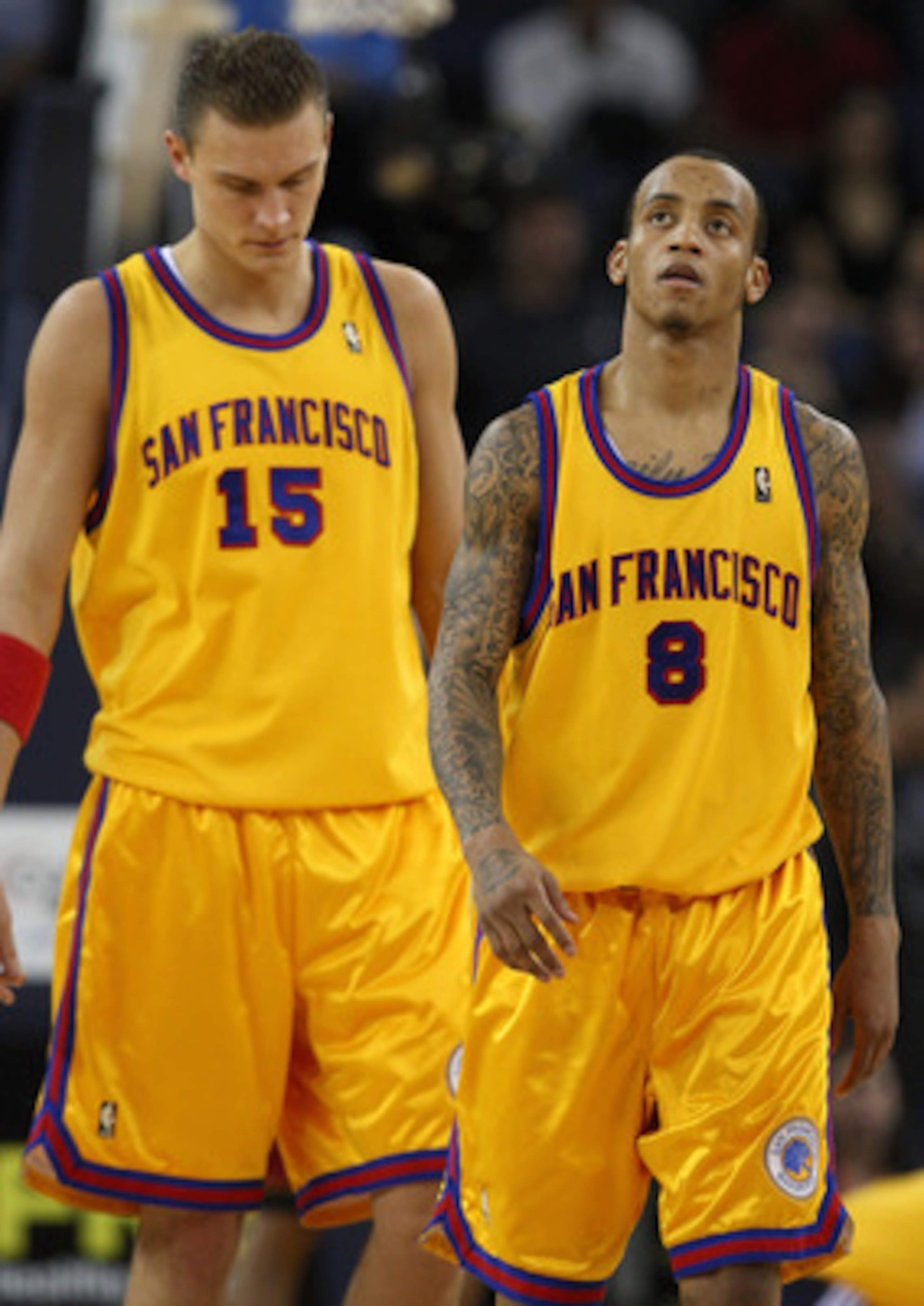 OAKLAND, CA - JANUARY 13:  Monta Ellis #8 and Andris Biedrins #15 of the Golden State Warriors look on against the Miami Heat during an NBA game at Oracle Arena on January 13, 2010 in Oakland, California.  NOTE TO USER: User expressly acknowledges and agr