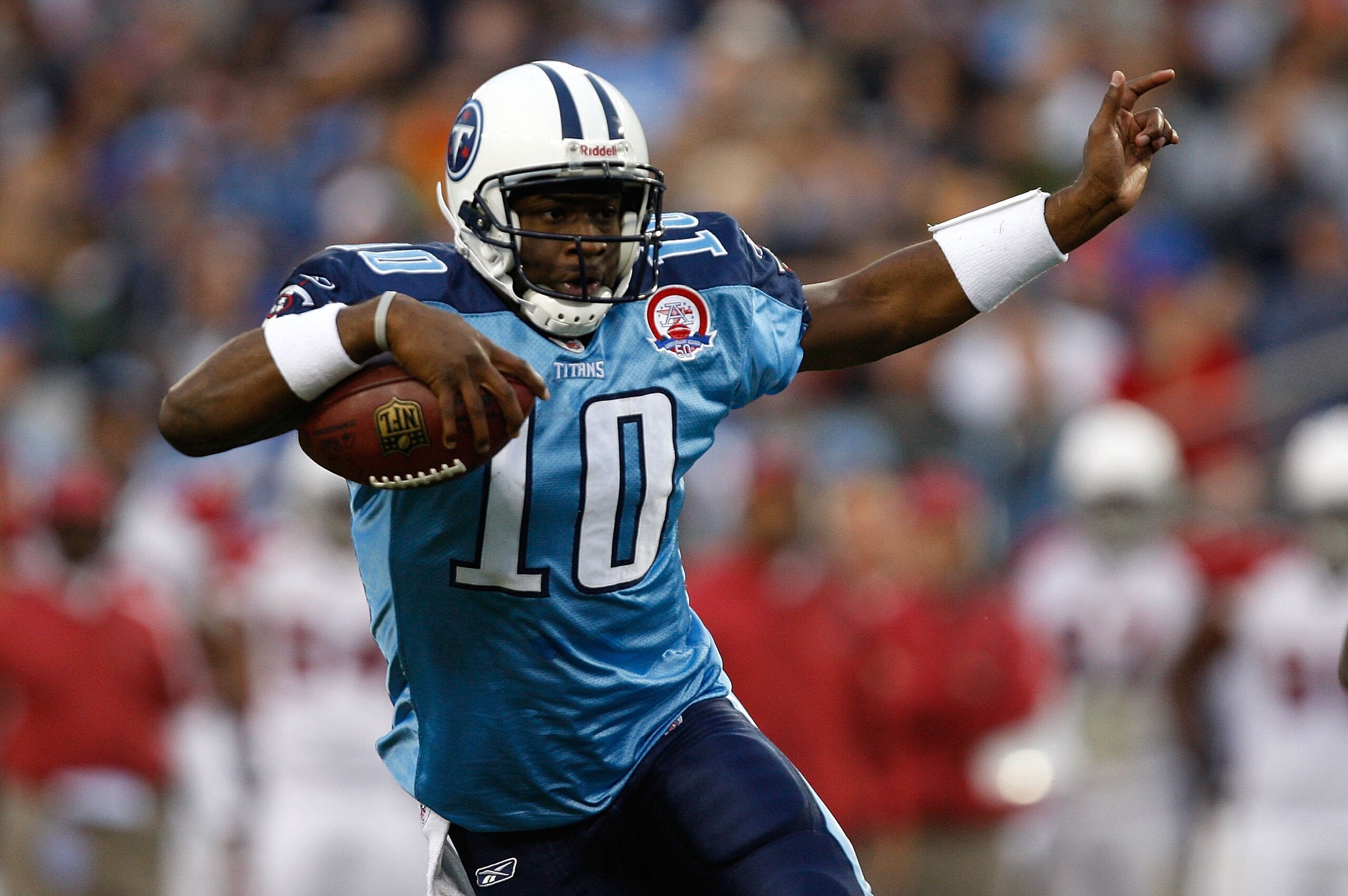 NASHVILLE, TN - NOVEMBER 29:  Vince Young #10 of the Tennessee Titans runs with the ball against the Arizona Cardinals during their game at LP Field on November 29, 2009 in Nashville, Tennessee.  (Photo by Streeter Lecka/Getty Images)