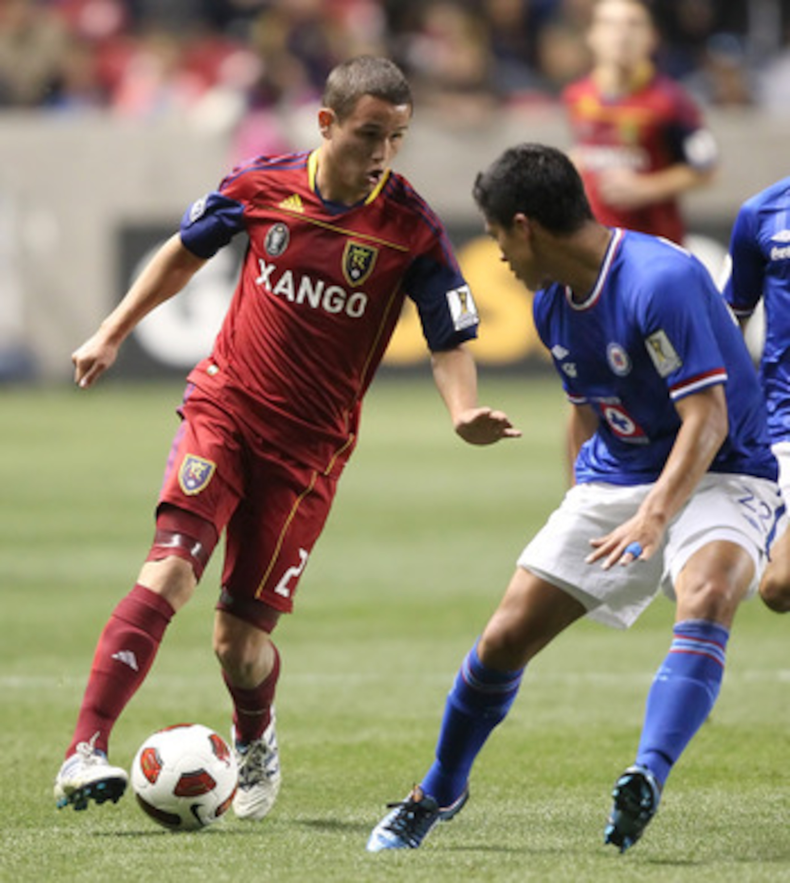 SANDY, UT - SEPTEMBER 19: Luis Gil #21 of Real Salt Lake moves the ball around Adrian Cortes #22 of Cruz Azul during the first half of an CONCACAF soccer game October 19, 2010 at Rio Tinto Stadium in Sandy, Utah. (Photo by George Frey/Getty Images)