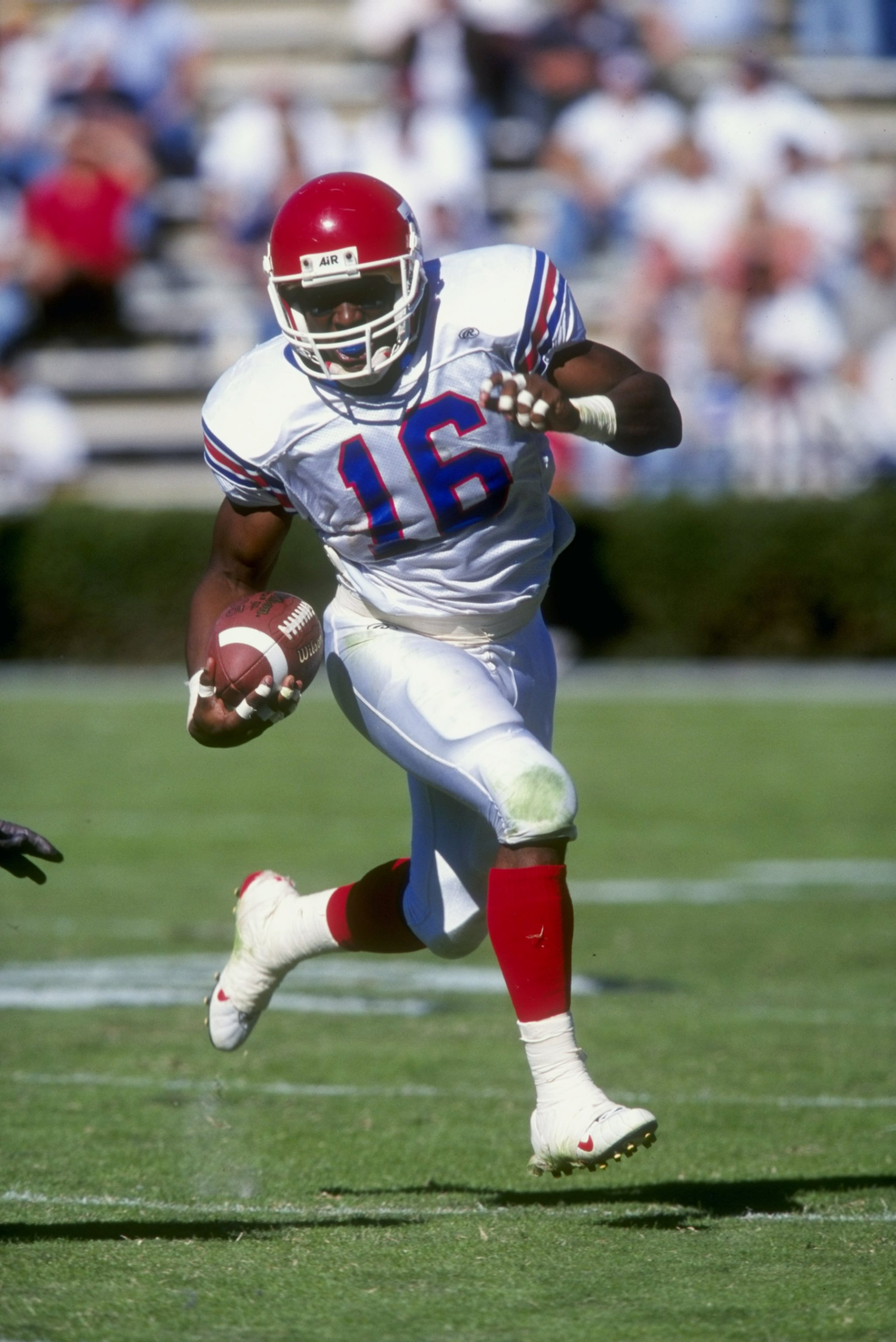 24 Oct 1998: Troy Edwards #16 of the Louisiana Tech Bulldogs grips the ball as he runs during the game against the Auburn Tigers at Jordan- Hare Stadium in Auburn, Alabama. Auburn defeated Lousiana Tech 32-17. Mandatory Credit: Tom Hauck  /Allsport