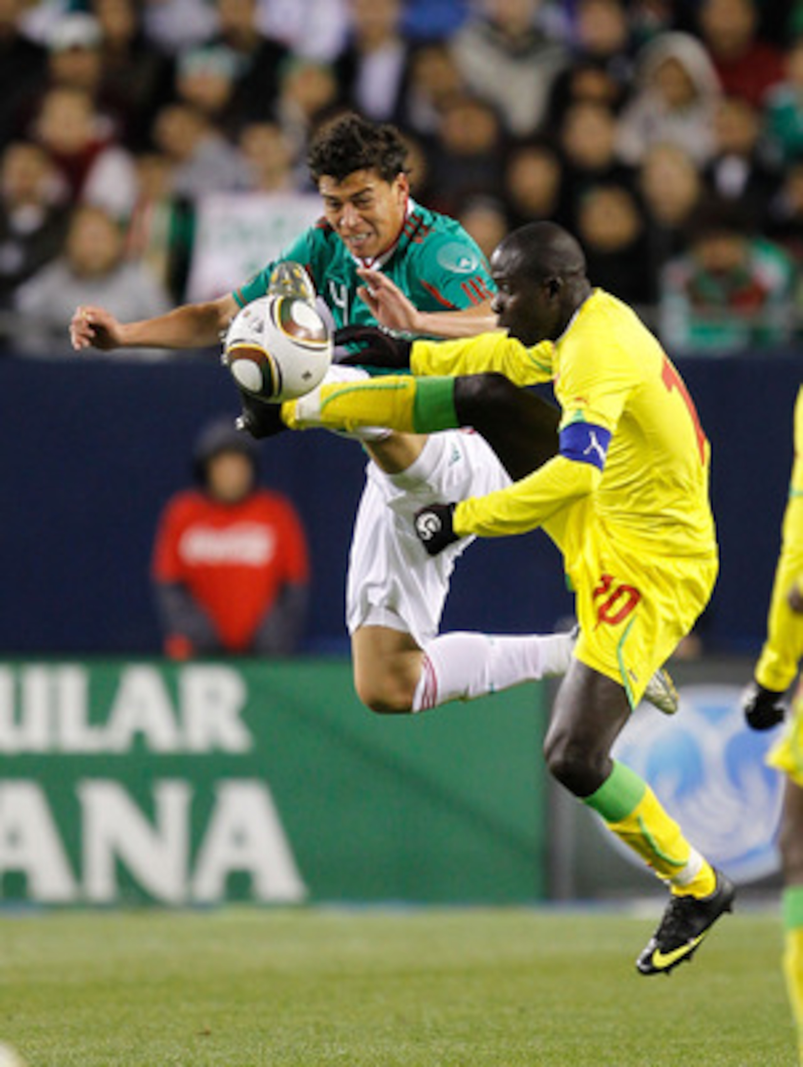 CHICAGO - MAY 10: Hector Moreno #4 of Mexico and Djibril Sidibe #10 of Senegal battle for control of the ball during an international friendly at Soldier Field on May 10, 2010 in Chicago, Illinois. Mexico defeated Senegal 1-0. (Photo by Jonathan Daniel/Ge
