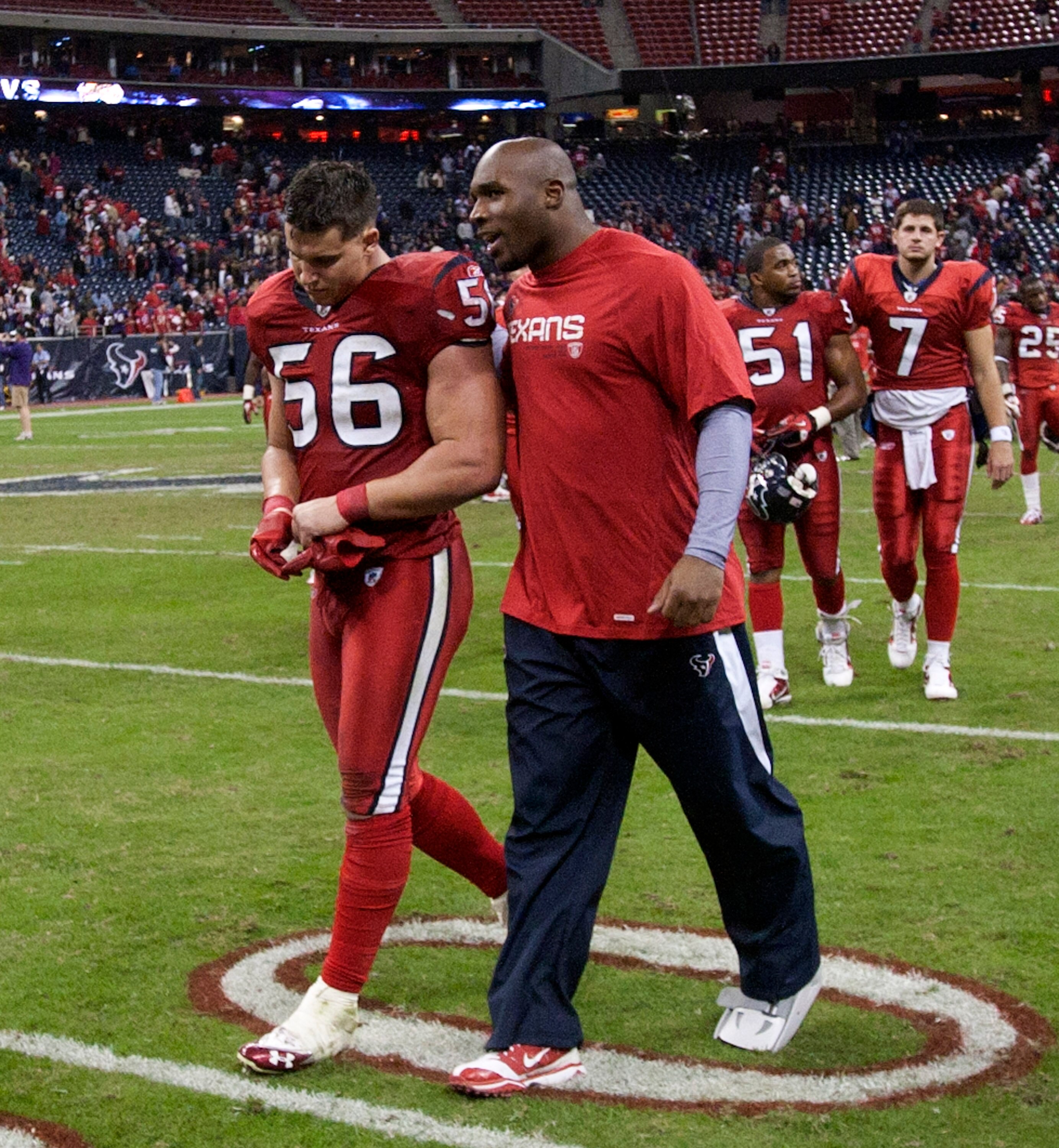 HOUSTON, TX - DECEMBER 13:  Linebacker Brian Cushing #56 and injured linebacker DeMeco Ryan walk off the field after Houston lost in overtime to Baltimore Ravens at Reliant Stadium on December 13, 2010 in Houston, Texas.  (Photo by Bob Levey/Getty Images)