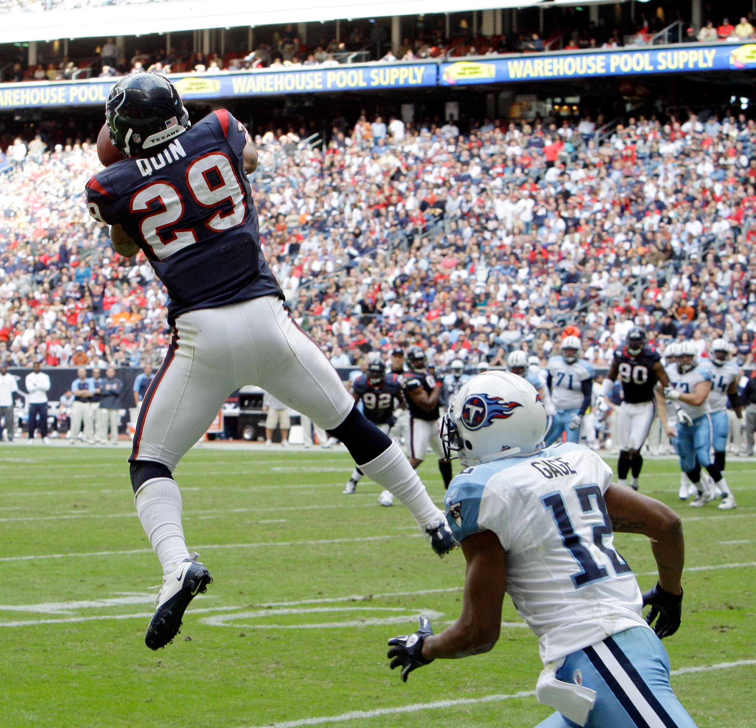 HOUSTON - NOVEMBER 28:  Cornerback Glover Quin #29 of the Houston Texans intercepts a pass intended for wide receiver Justin Gage #12 of the Tennessee Titans at Reliant Stadium on November 28, 2010 in Houston, Texas.  (Photo by Bob Levey/Getty Images)