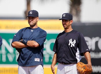 TAMPA, FL - FEBRUARY 20: Robinson Cano #24 Derek Jeter #2 and Jorge Posada #20 of the New York Yankees watch the action during the first full team workout of Spring Training on February 20, 2011 at the George M. Steinbrenner Field in Tampa, Florida.  (Pho