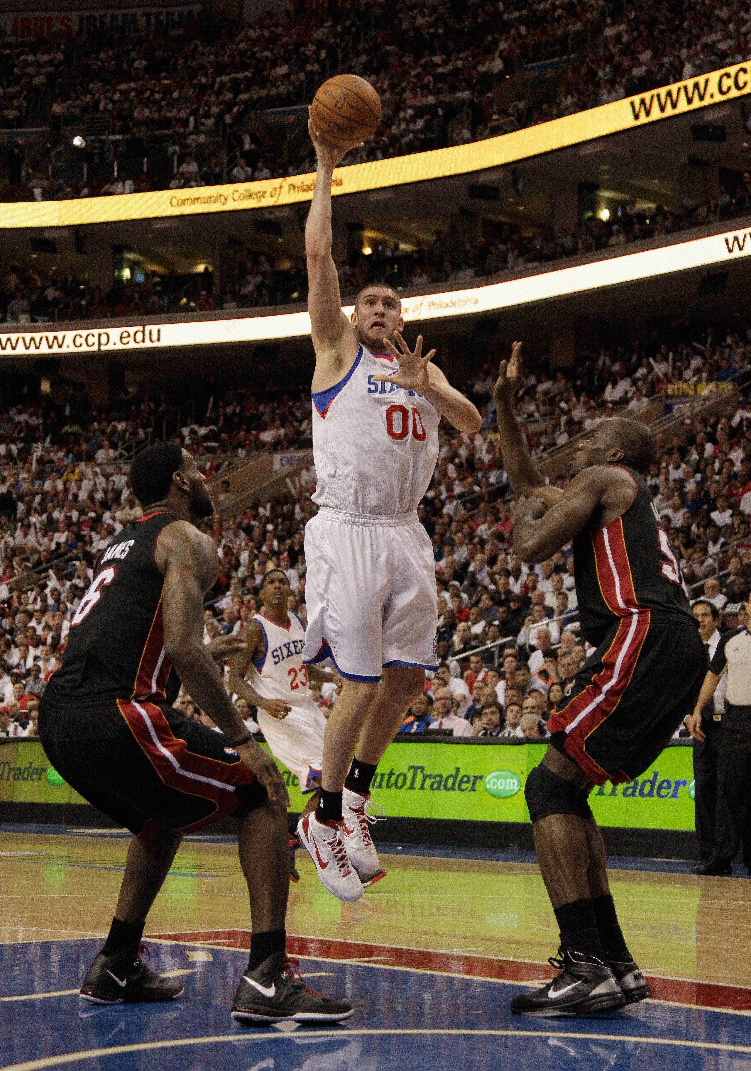 PHILADELPHIA, PA - APRIL 21: Spencer Hawes #00 of the Philadelphia 76ers puts up a shot against the Miami Heat in Game Three of the Eastern Conference Quarterfinals during the 2011 NBA Playoffs at Wells Fargo Center on April 21, 2011 in Philadelphia, Penn