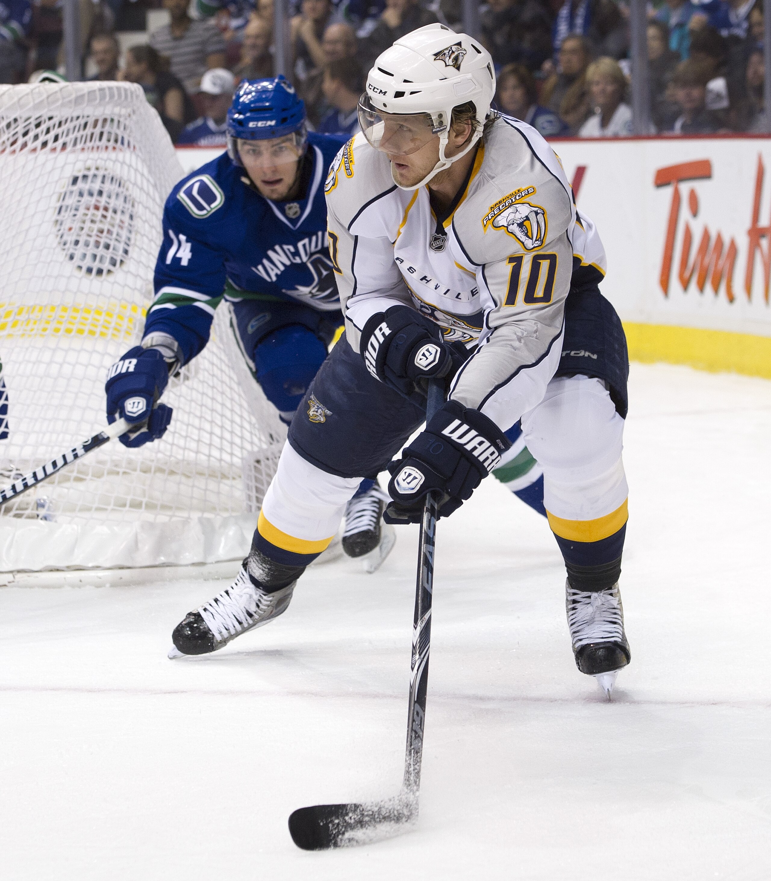 VANCOUVER, CANADA - APRIL 28: Martin Erat #10 of the Nashville Predators looks to make a pass as he is watched by Alexandre Burrows #14 of the Vancouver Canucks during the first period in Game One of the Western Conference Semifinals during the 2011 NHL S VANCOUVER, CANADA - APRIL 28: Martin Erat #10 of the Nashville Predators looks to make a pass as he is watched by Alexandre Burrows #14 of the Vancouver Canucks during the first period in Game One of the Western Conference Semifinals during the 2011 NHL S