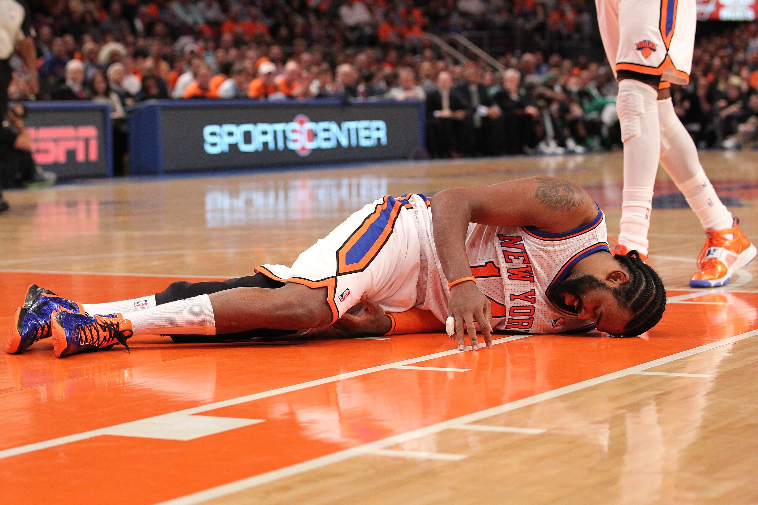 NEW YORK, NY - APRIL 24:  Ronny Turiaf #14 of the New York Knicks lies on the court in pain against the Boston Celtics in Game Four of the Eastern Conference Quarterfinals during the 2011 NBA Playoffs on April 24, 2011 at Madison Square Garden in New York