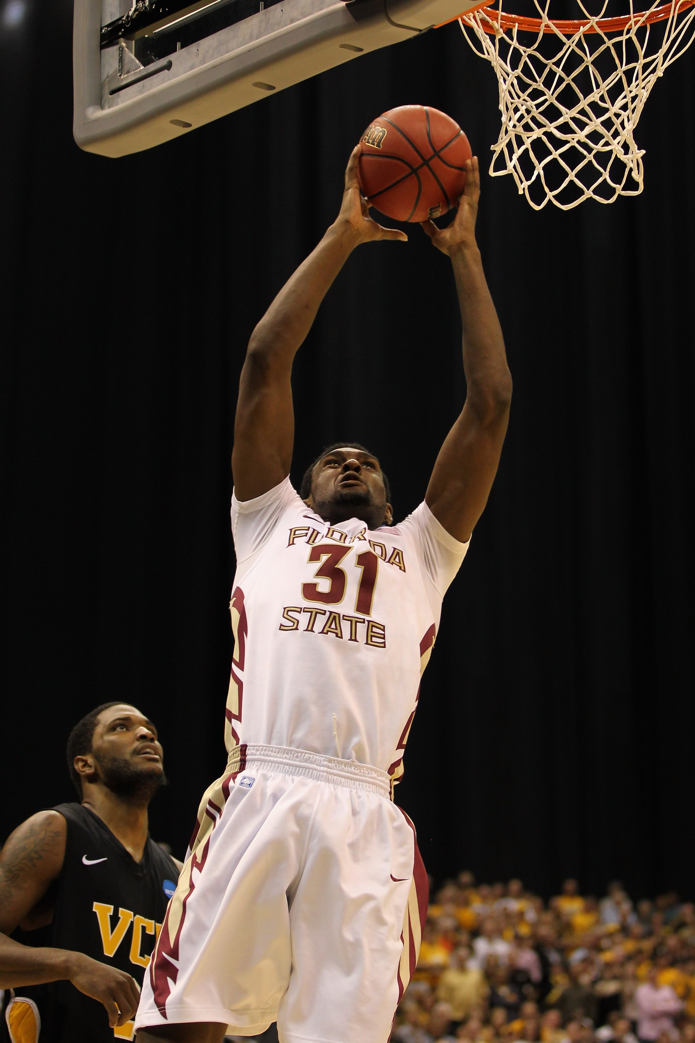 SAN ANTONIO, TX - MARCH 25: Chris Singleton #31 of the Florida State Seminoles goes to the basket against Jamie Skeen #21 of the Virginia Commonwealth Rams during the southwest regional of the 2011 NCAA men's basketball tournament at the Alamodome on Mar SAN ANTONIO, TX - MARCH 25: Chris Singleton #31 of the Florida State Seminoles goes to the basket against Jamie Skeen #21 of the Virginia Commonwealth Rams during the southwest regional of the 2011 NCAA men's basketball tournament at the Alamodome on Mar