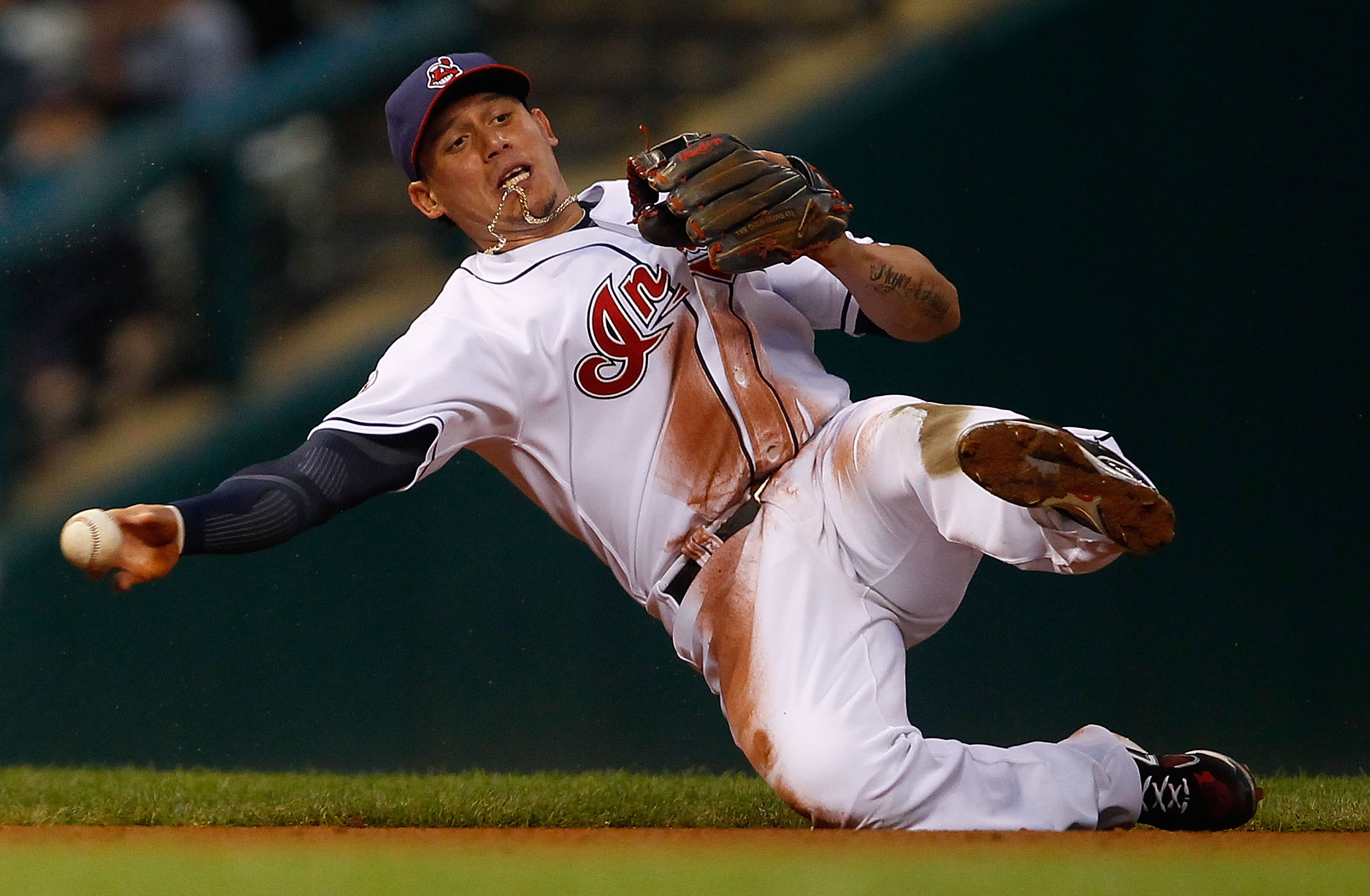 CLEVELAND - MAY 13:  Asdrubal Cabrera #13 of the Cleveland Indians fields a ground ball against the Seattle Mariners during the game on May 13, 2011 at Progressive Field in Cleveland, Ohio.  (Photo by Jared Wickerham/Getty Images)