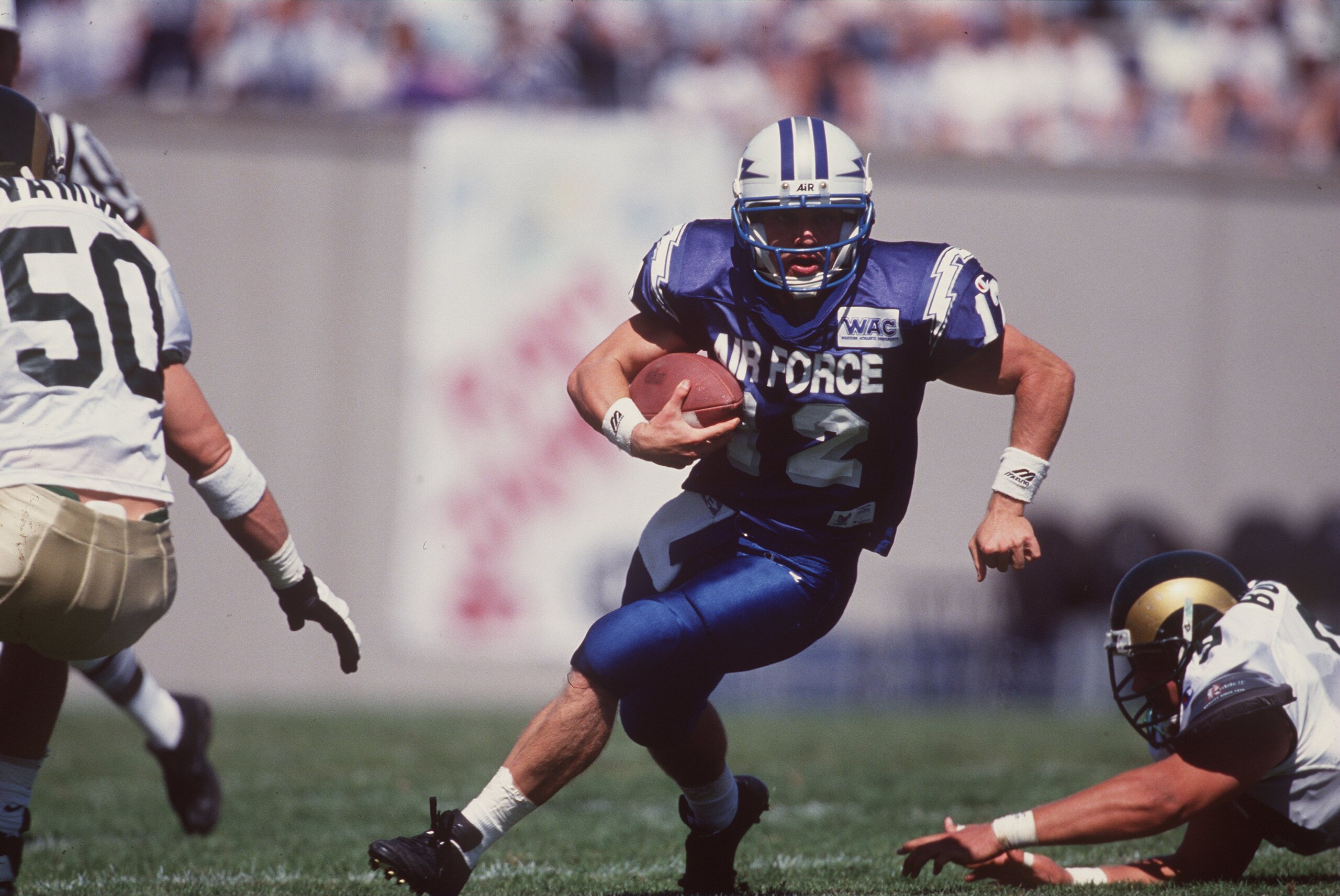 16 Sep 1995:  Quarterback Beau Morgan #12 of the Air Force Falcons looks up field as he scans the defense for an opening while running with the football during a carry in the Falcons 27-20 loss to the Colorado State Rams at Falcon Stadium in Colorado Spri