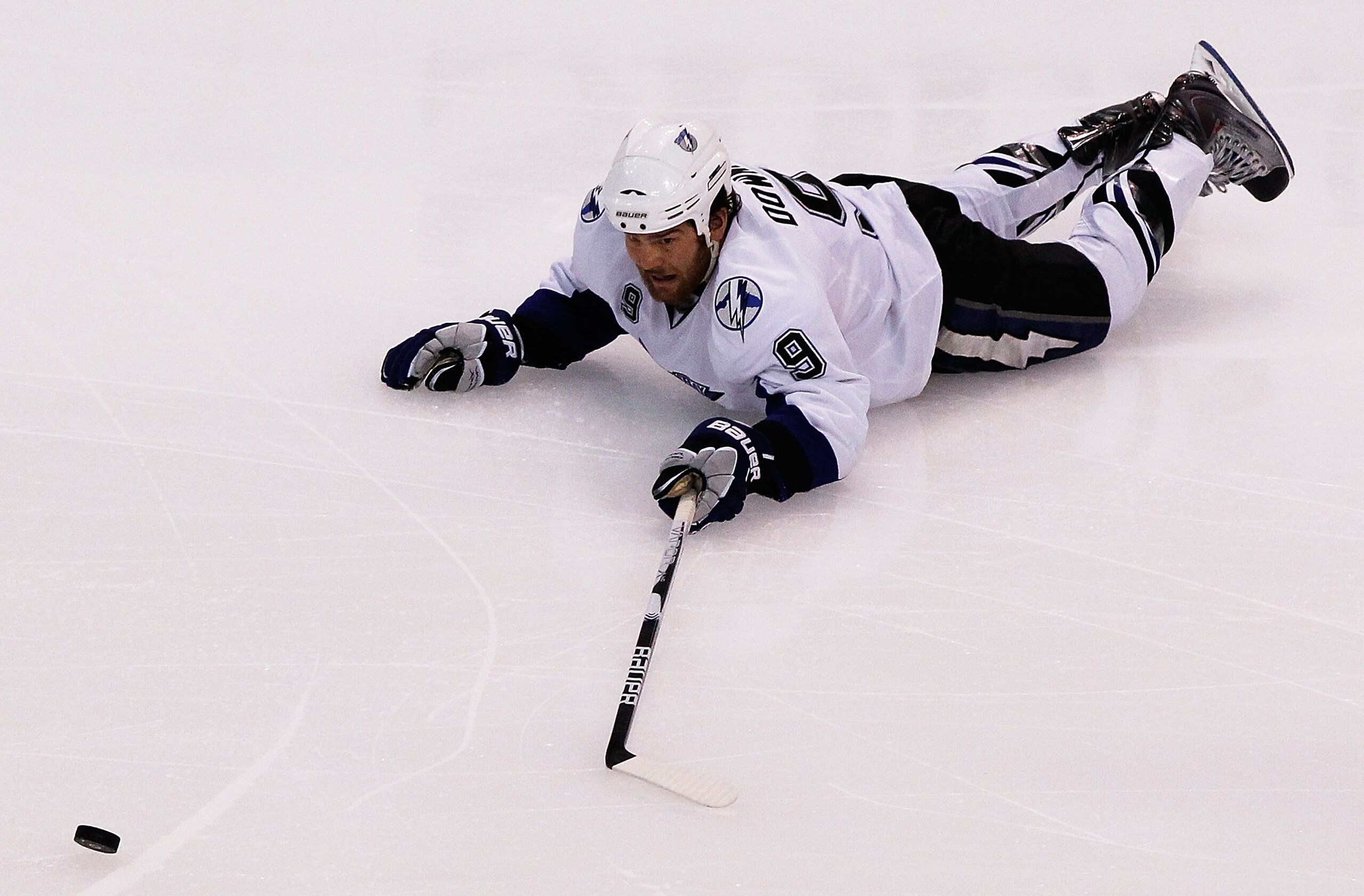 BOSTON, MA - MAY 14: Steve Downie #9 of the Tampa Bay Lightning falls to the ice against the Boston Bruins in Game One of the Eastern Conference Finals during the 2011 NHL Stanley Cup Playoffs at TD Garden on May 14, 2011 in Boston, Massachusetts. (Phot BOSTON, MA - MAY 14: Steve Downie #9 of the Tampa Bay Lightning falls to the ice against the Boston Bruins in Game One of the Eastern Conference Finals during the 2011 NHL Stanley Cup Playoffs at TD Garden on May 14, 2011 in Boston, Massachusetts. (Phot